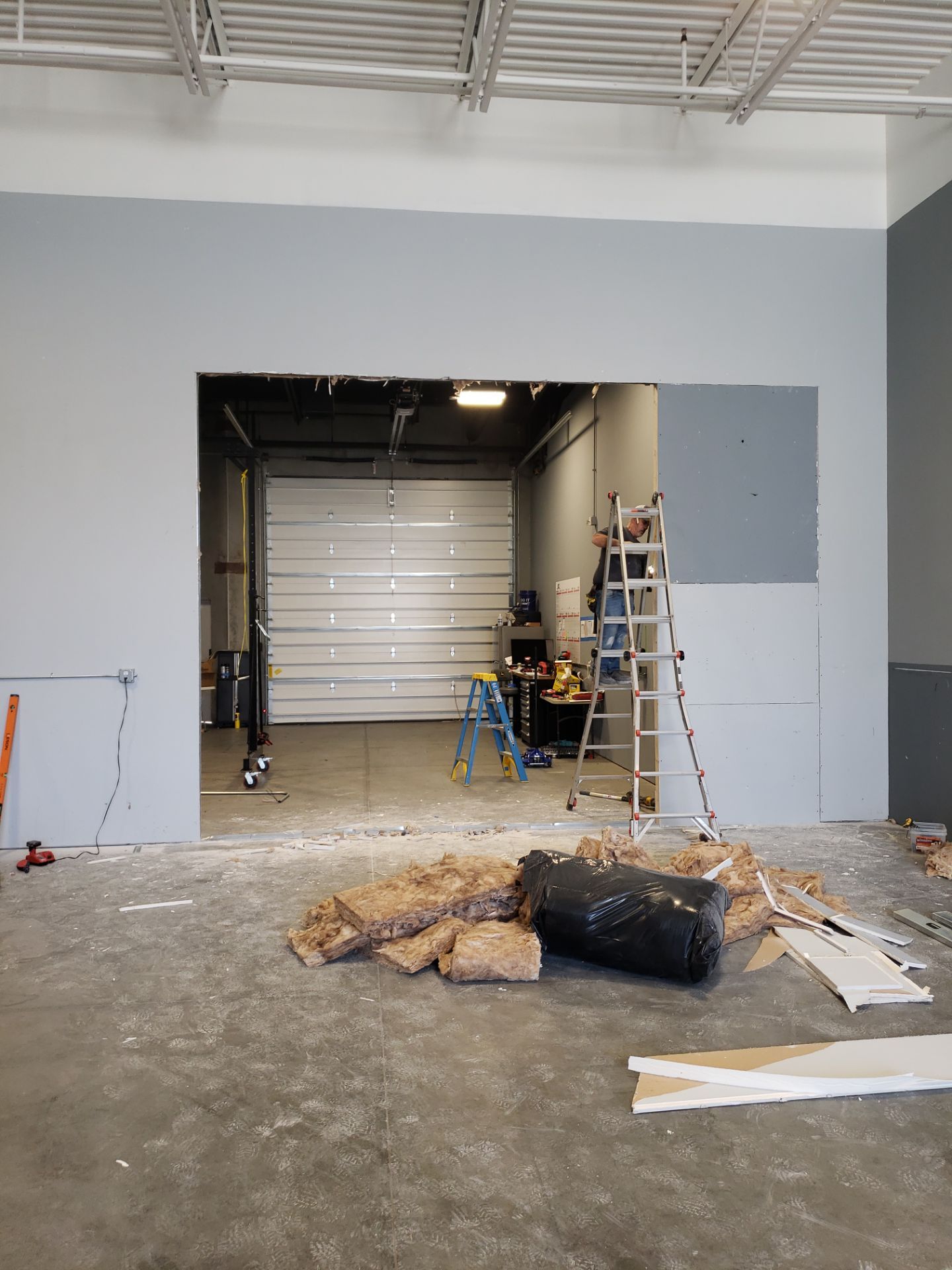 Commercial Shop Expansion Complete by A Step Above Handy LLC