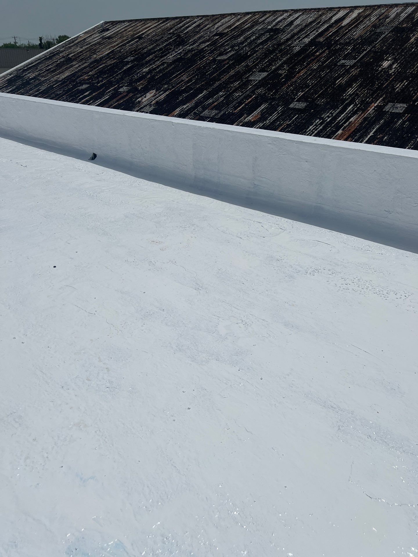 Dirty leaking Gravel Roof by Bayfront Roofing and Construction