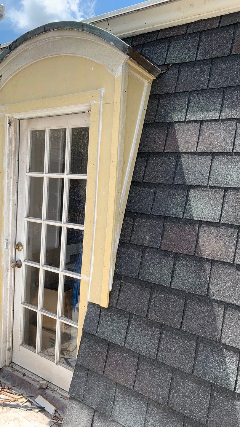 Mansard Charm by Bayfront Roofing and Construction