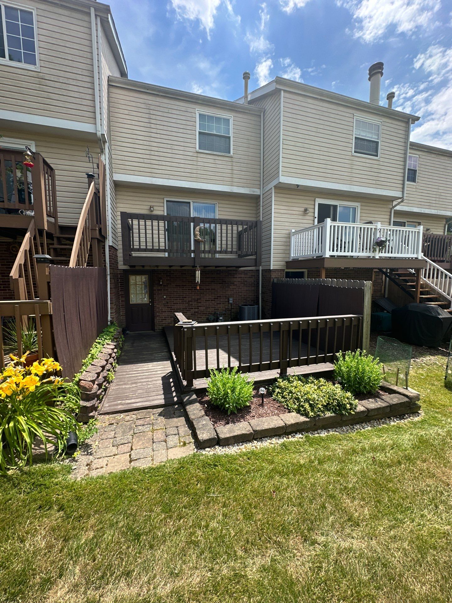 Stamped concrete and redeck  by Cousins Roofing Siding & Decks