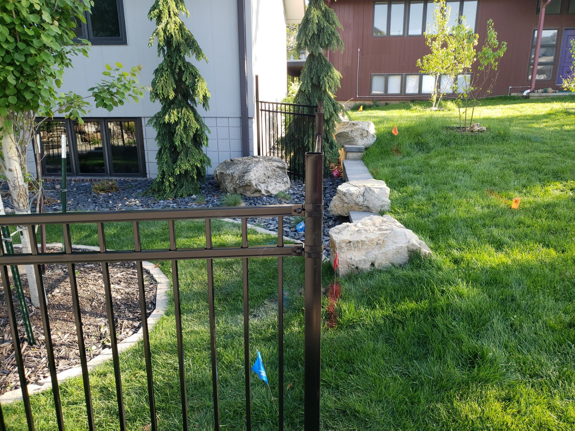 Ornamental Black Metal Picket Fence Installation in Cedar Falls by Perfect Picket Fence and Stain