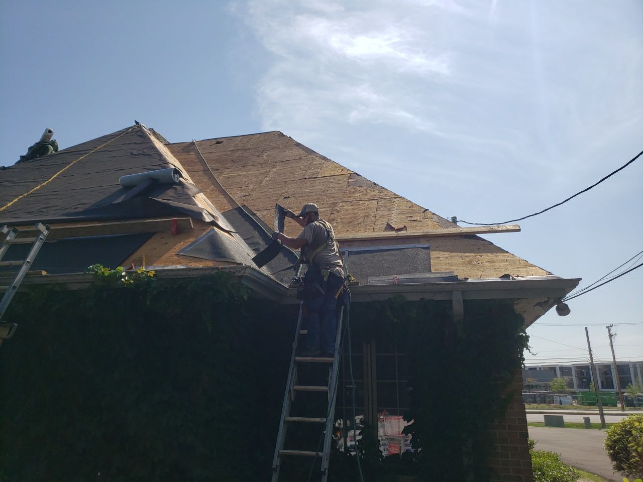 Asphalt Roof Replacement and Aluminum Gutter Installment  by Custom Installations