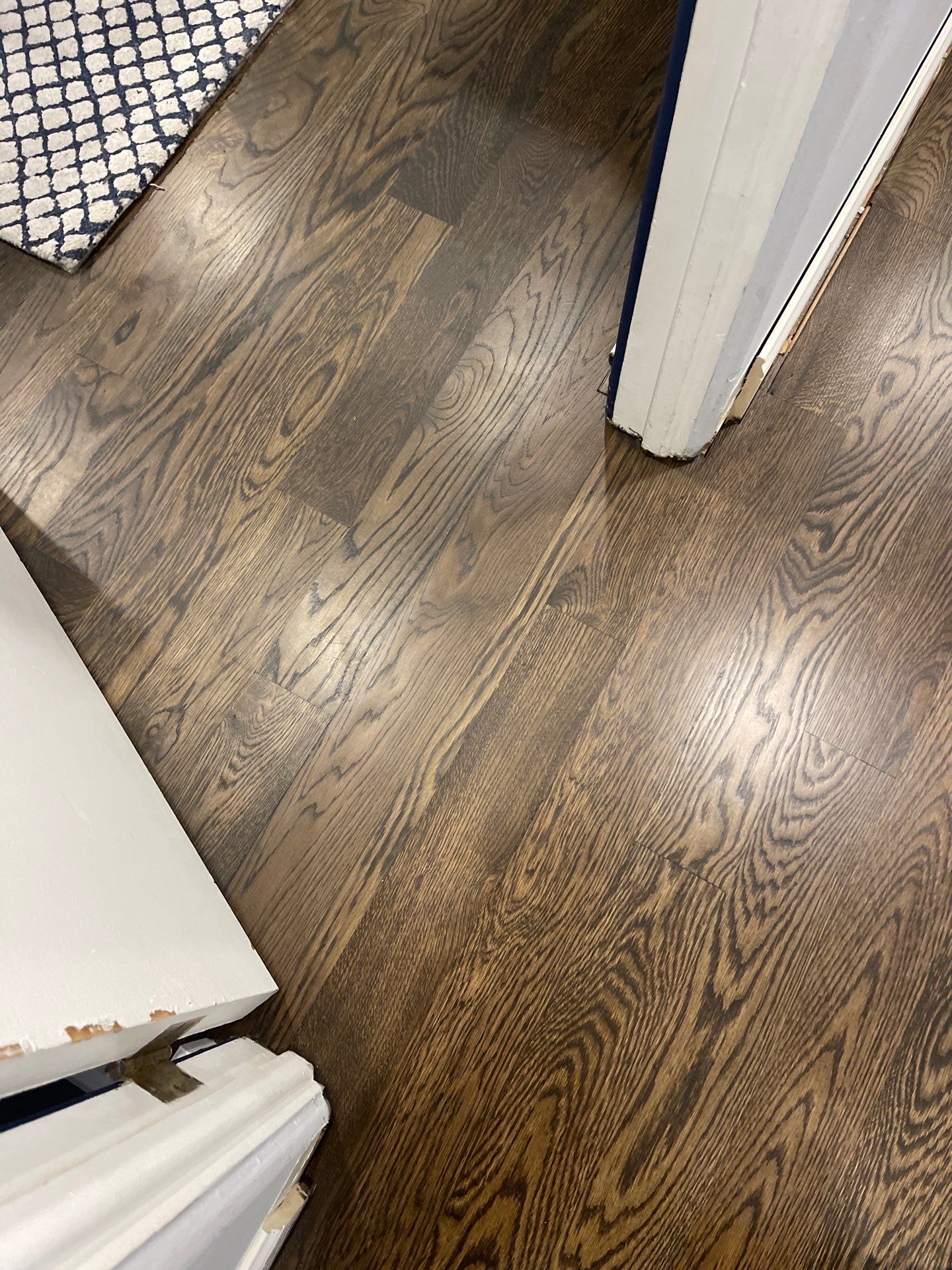 New Flooring installation using 4" White oak select grade plain sawn Ebony Stain by Ann Arbor Hardwoods