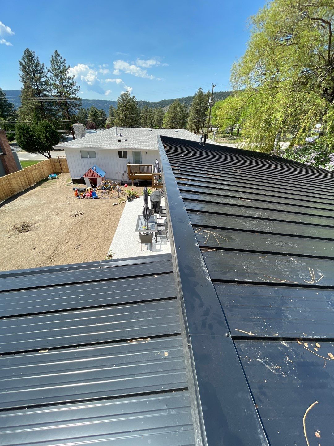 Residential Roofing Installation using 12" Prolok metal  by Top Notch Roofing Inc