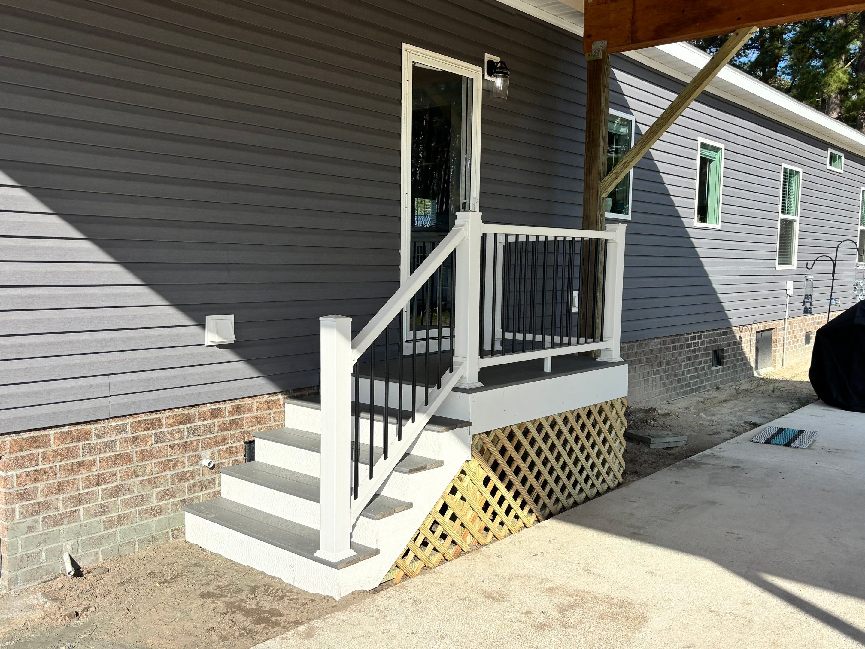 Custom Trex Covered Deck and Gabled Roof in Winterville by The Remodeling Company