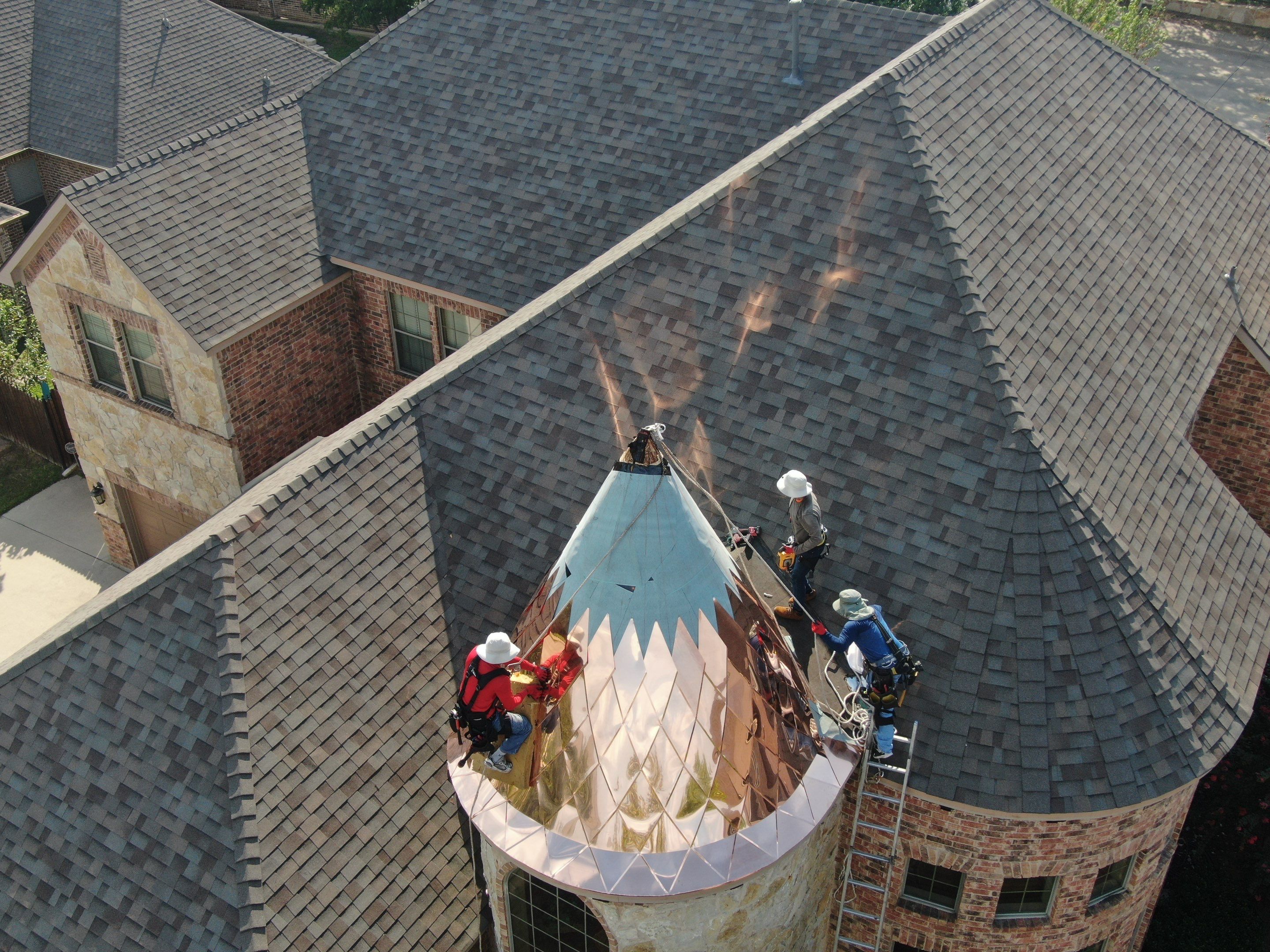 Installing Custom copper turret and Malarkey Vista Class 4 shingles Hail Damage Upgrade by Becker Roofing and Exteriors