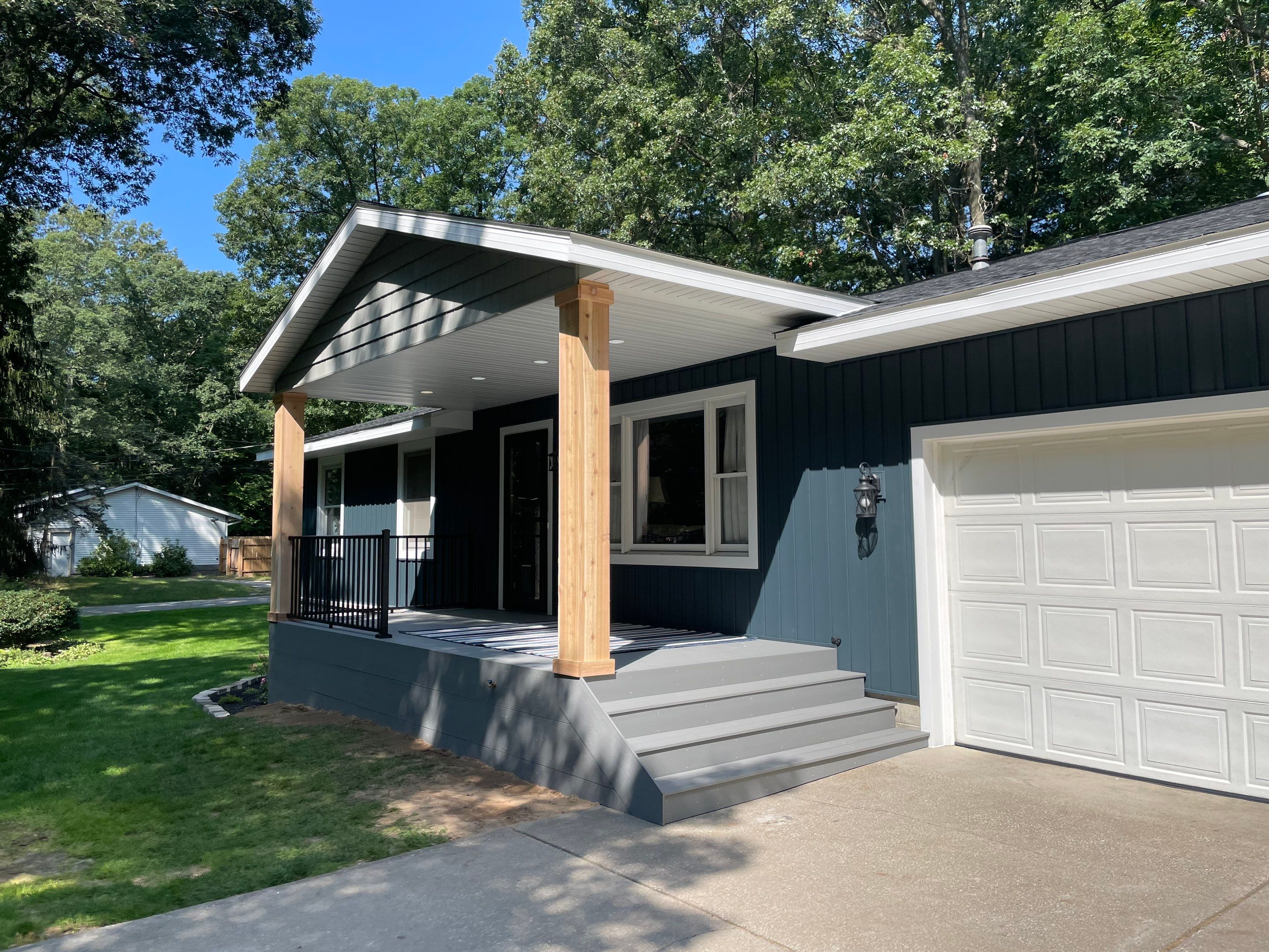 Siding, Deck and Versetta Stone by Avalon Roofing and Exteriors