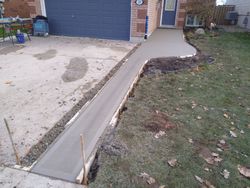 Crew finishing the concrete during the Smith curb and walkway project in Shelburne