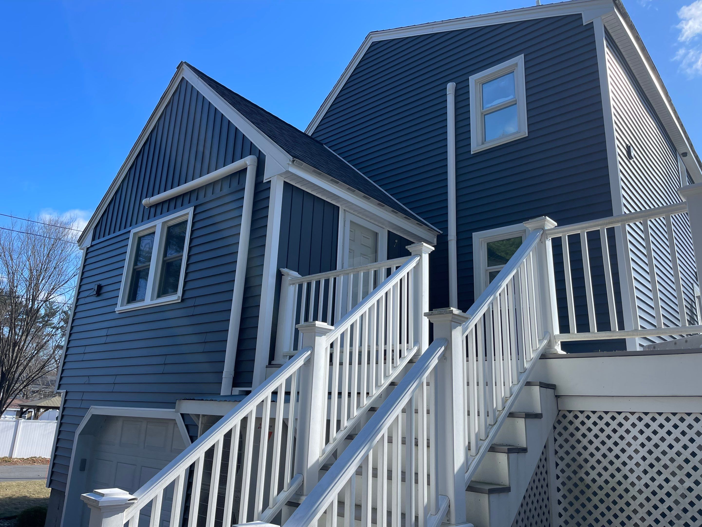 Complete Exterior Renovation with New Siding & Gutters   by Sensible Home Solutions