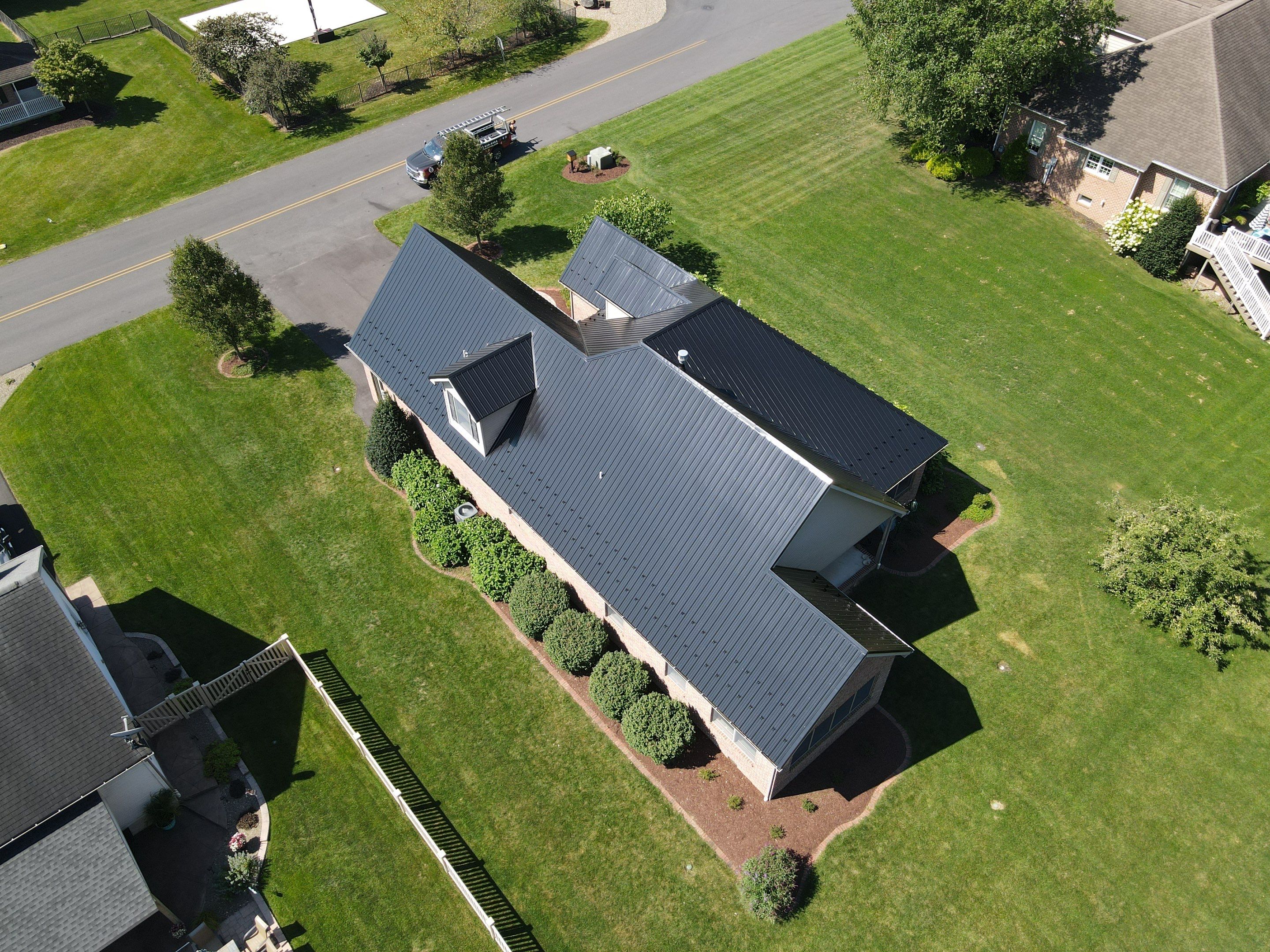 Standing seam / Azm panel in black  by Teflon Roofing