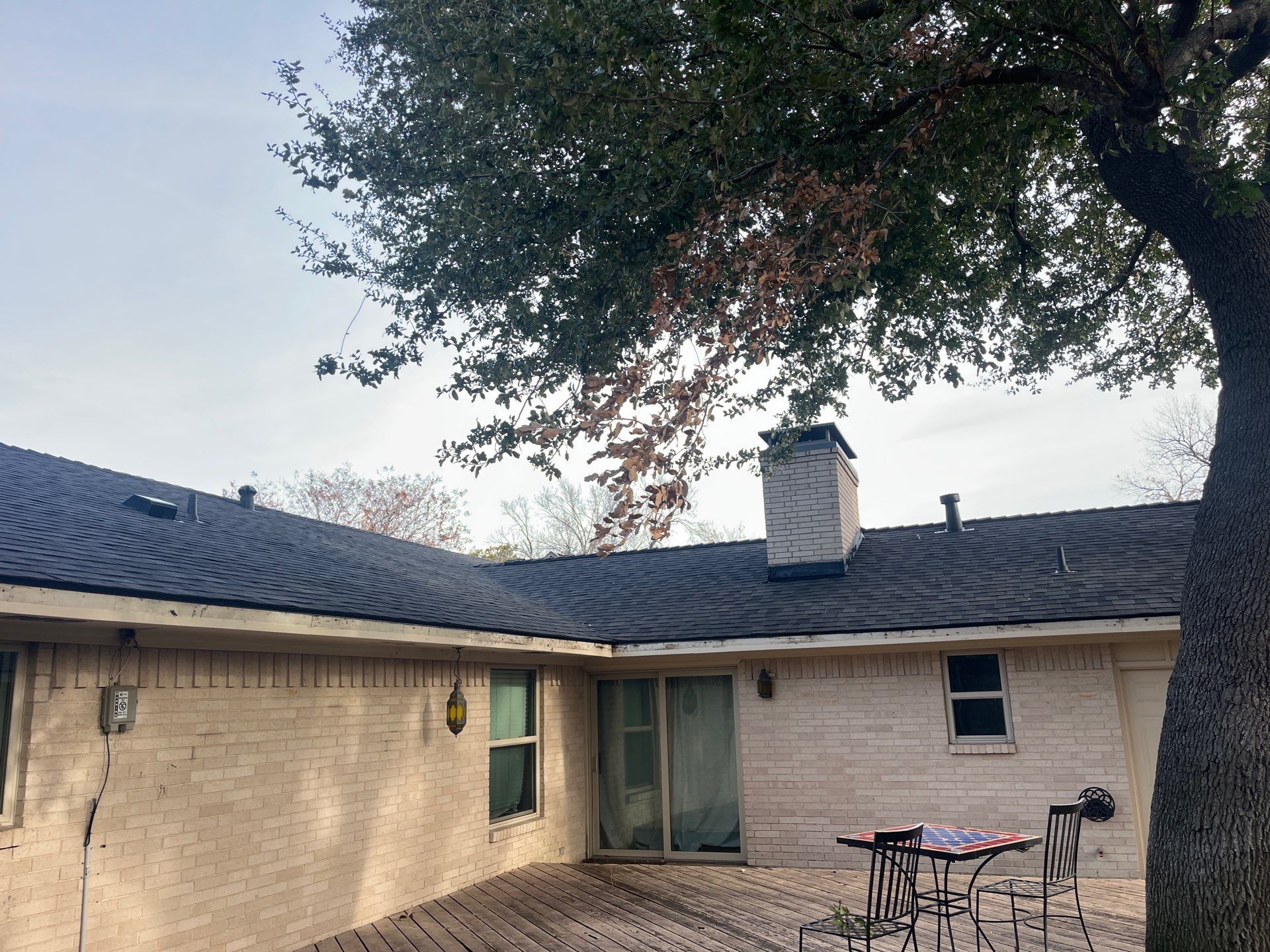 IKO Brownstone- White Brick  by Tejas Roofworks + Restoration