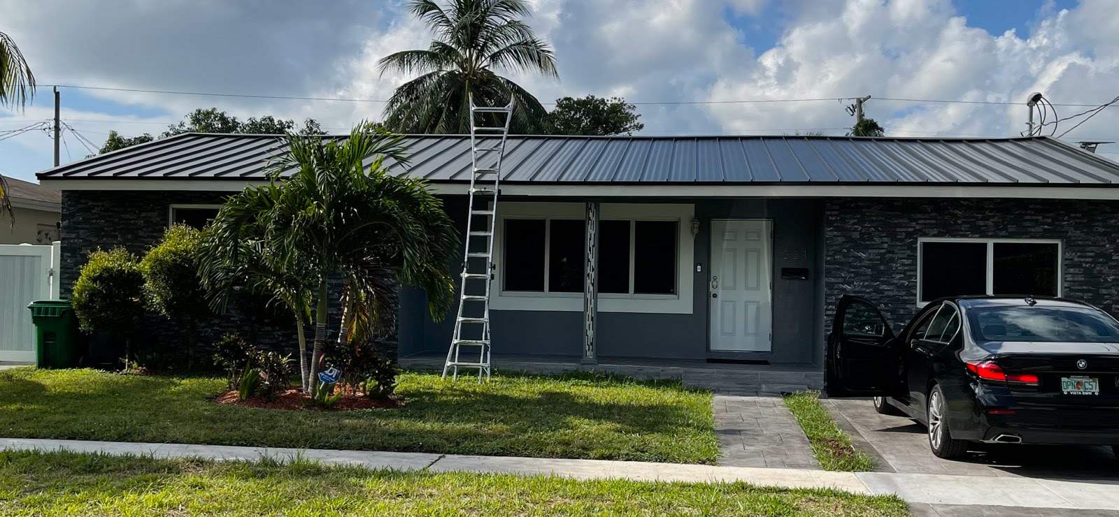 Standing Seam Metal & Flat Re-Roof using 1.5" Nail Strip 24ga Black Matte Kynar Coated Standing Seam Metal Panels by Morton Roofing, Inc.