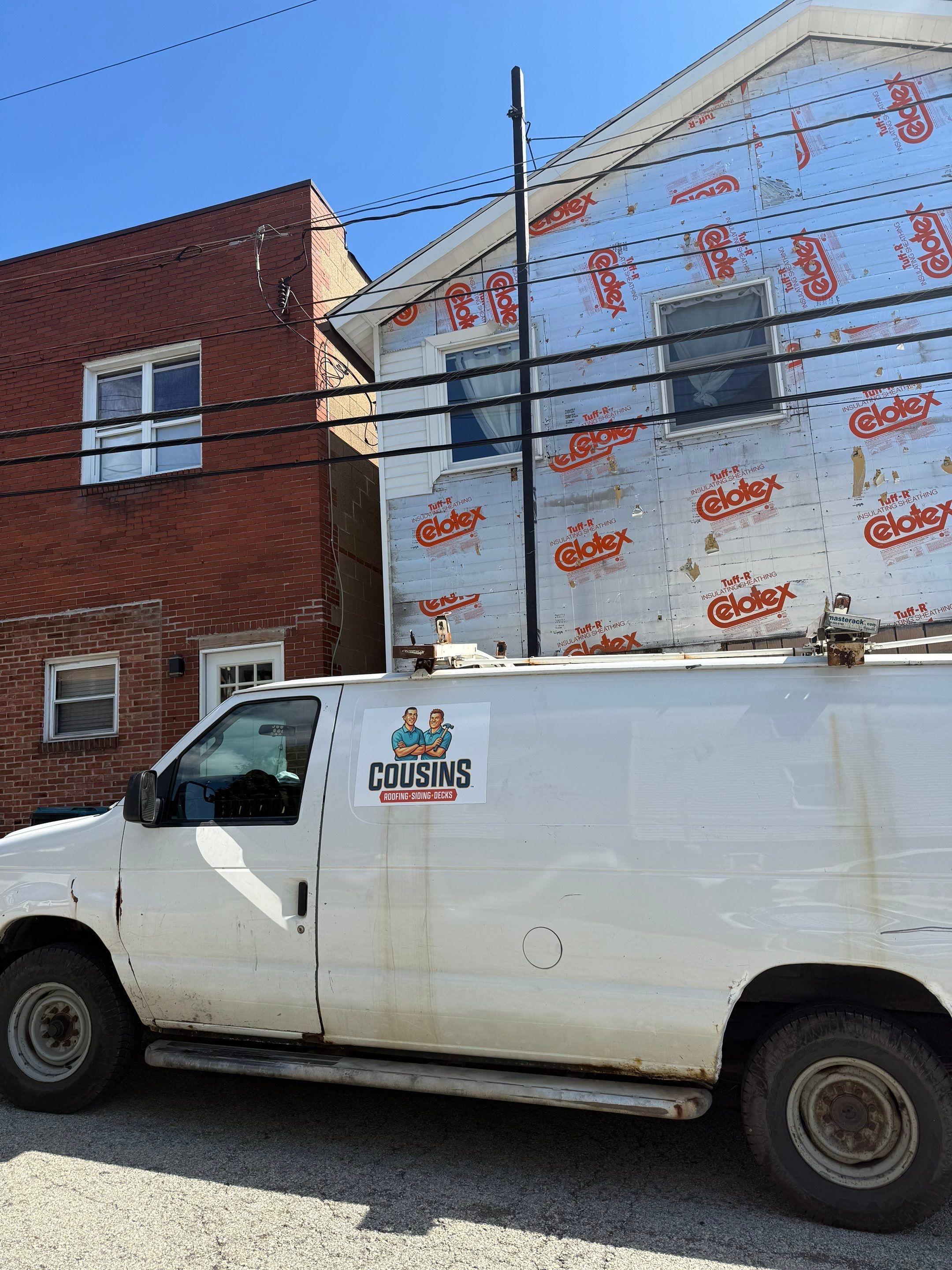 White siding  by Cousins Roofing Siding & Decks