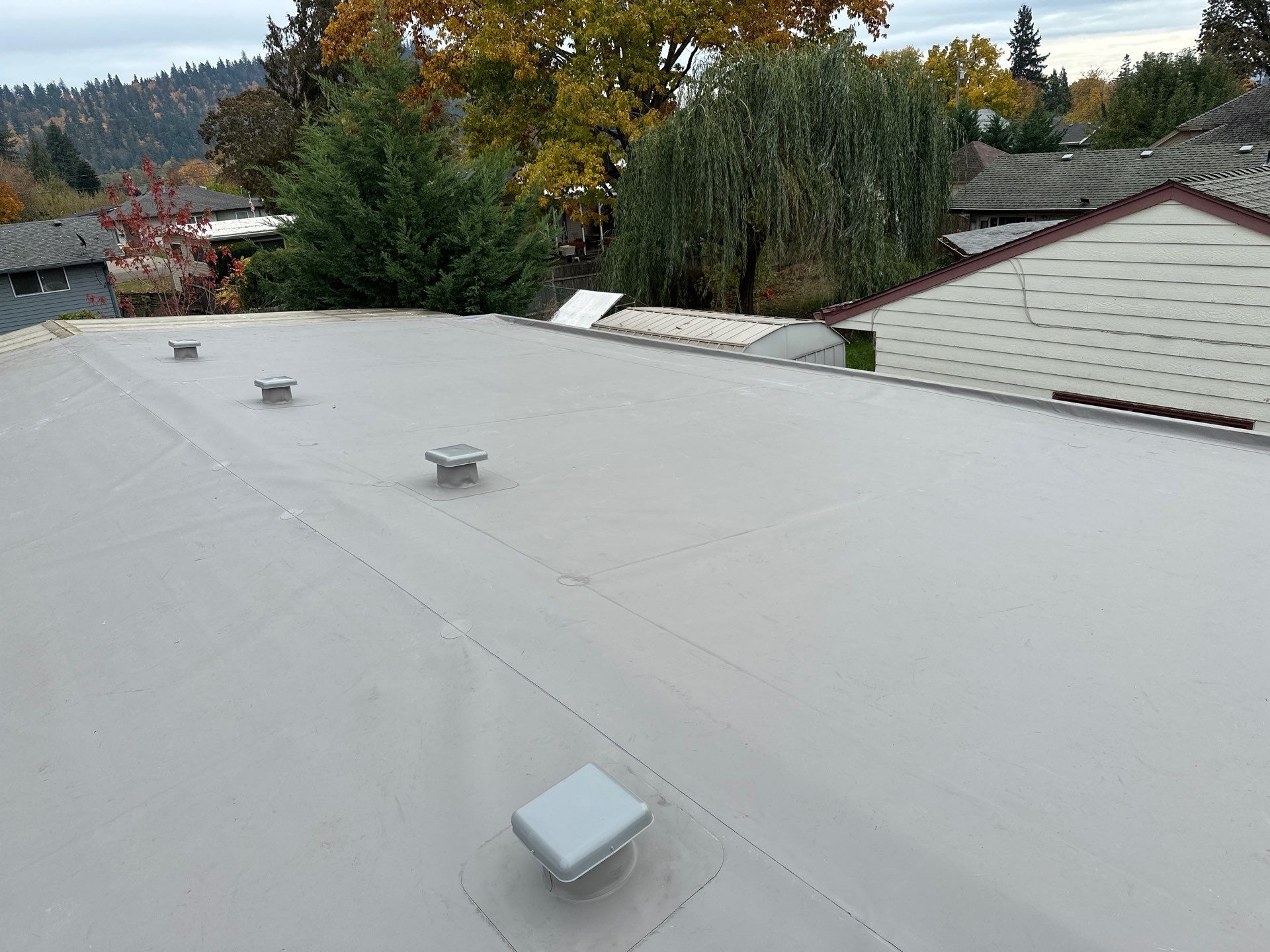 Residential Membrane Roof Replacement by Orezona Building & Roofing Company, Inc.