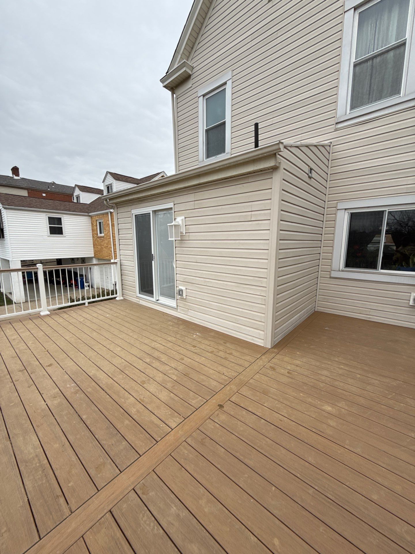 Deck and door by Cousins Roofing Siding & Decks