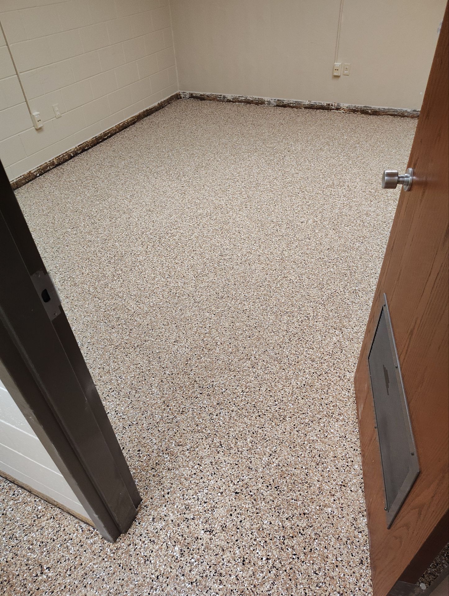 Industrial Flake Epoxy Floor Installation at Pierre National Guard Facility by Select Painting, Coatings & Garage Cabinets