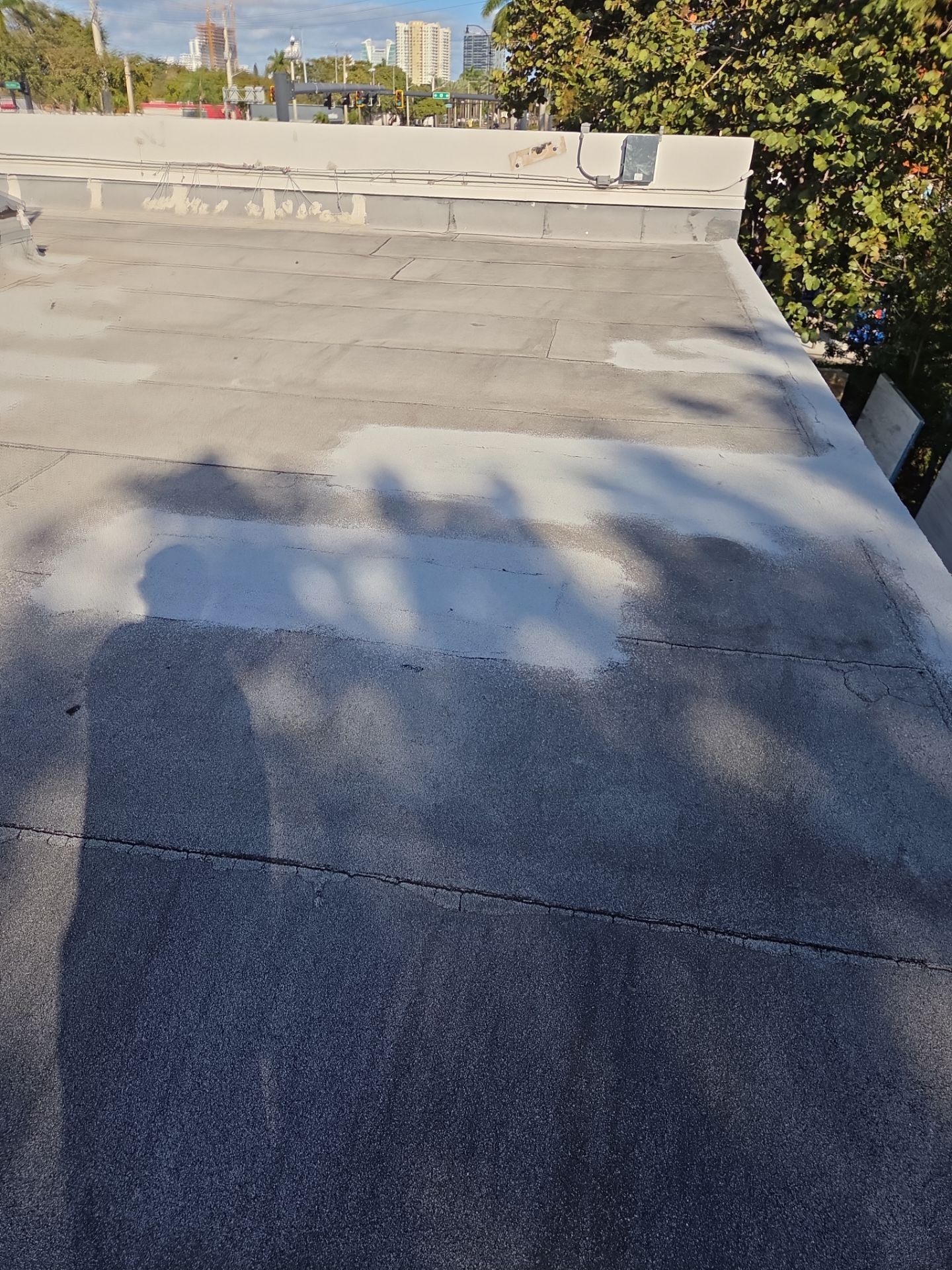 Commercial Flat Roof Restoration Using Silicone Coating in Hallandale Beach by Aastro Roofing