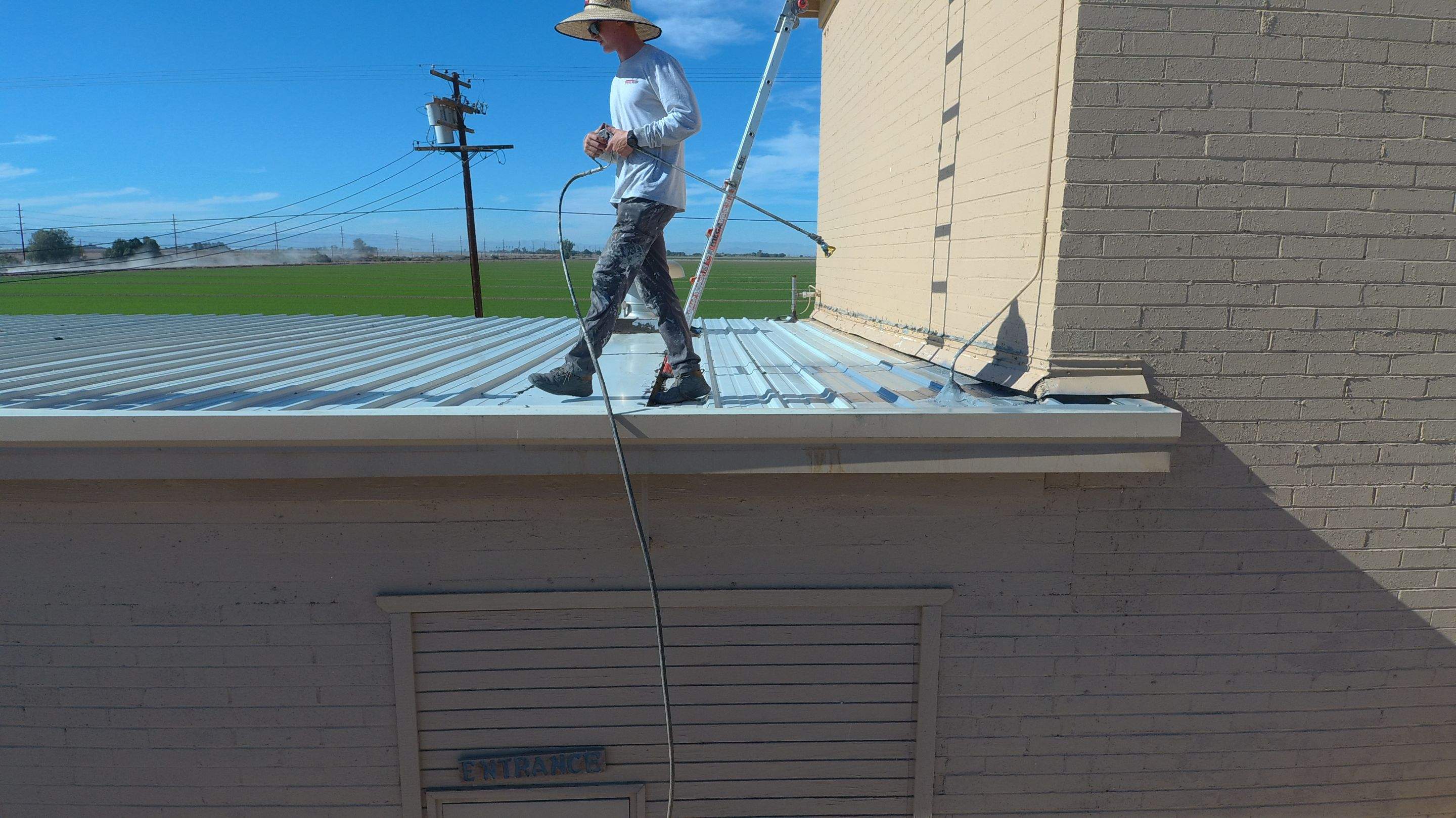 Metal roof restoration on commercial roof using Conklin Benchmark/PUMA XL fabric and coating by Straight Edge Roofing Inc