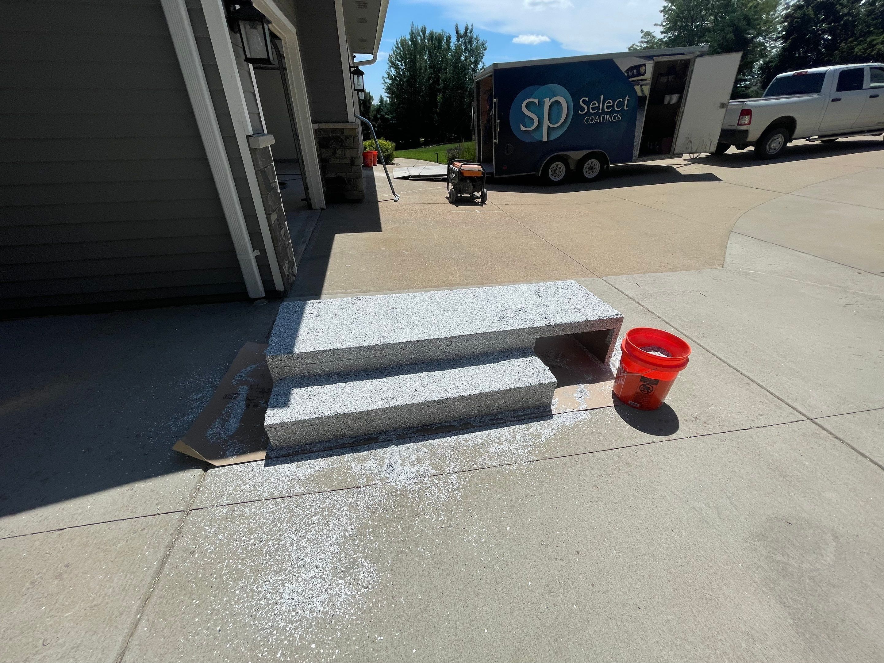 Feather Grey Garage Floor Coating Installation in Sioux Falls by Select Painting, Coatings & Garage Cabinets