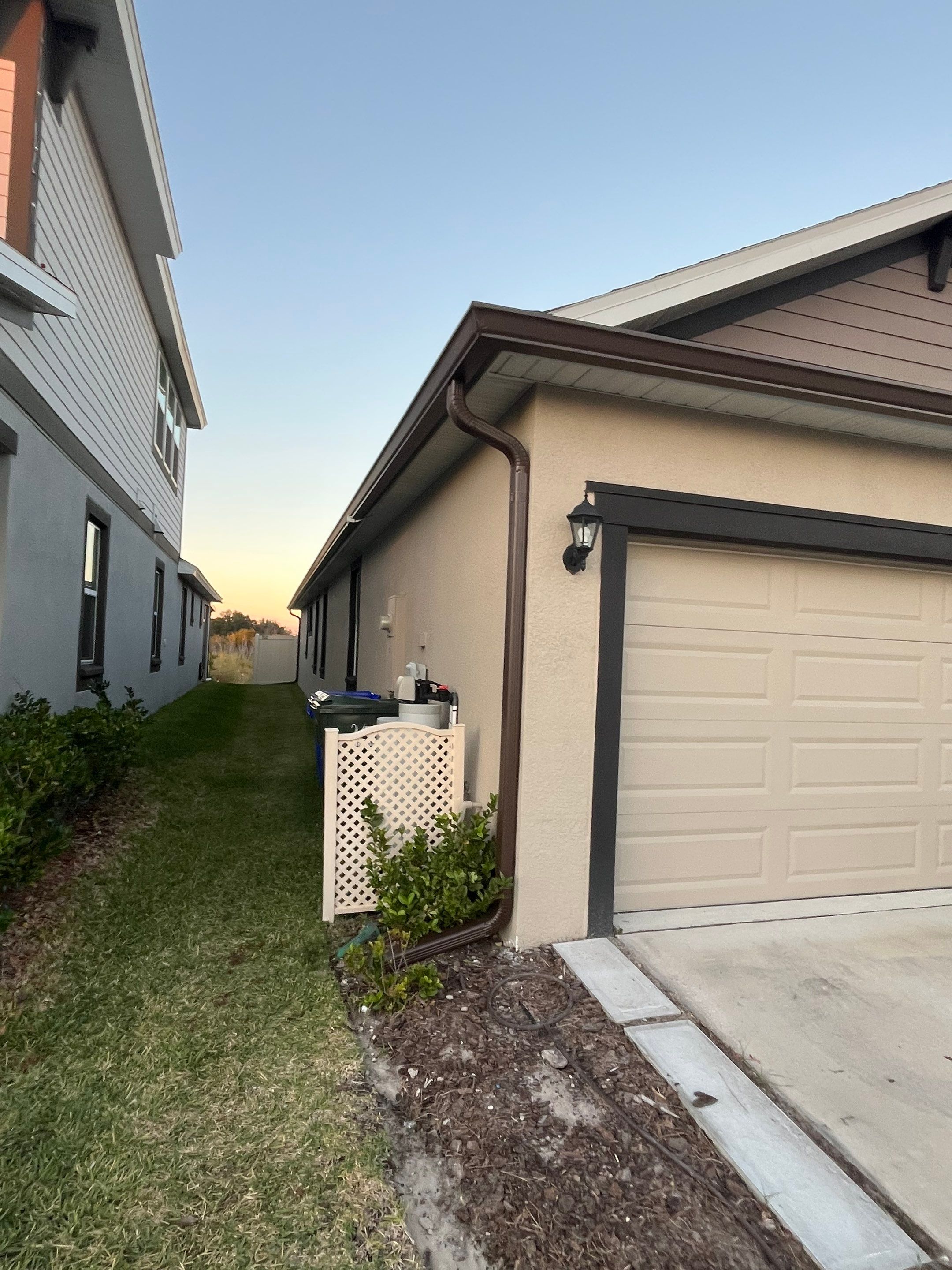 3X4 elbow Downspouts using Musket Brown Seamless Gutters in Lakeland FL by Gutter Professors