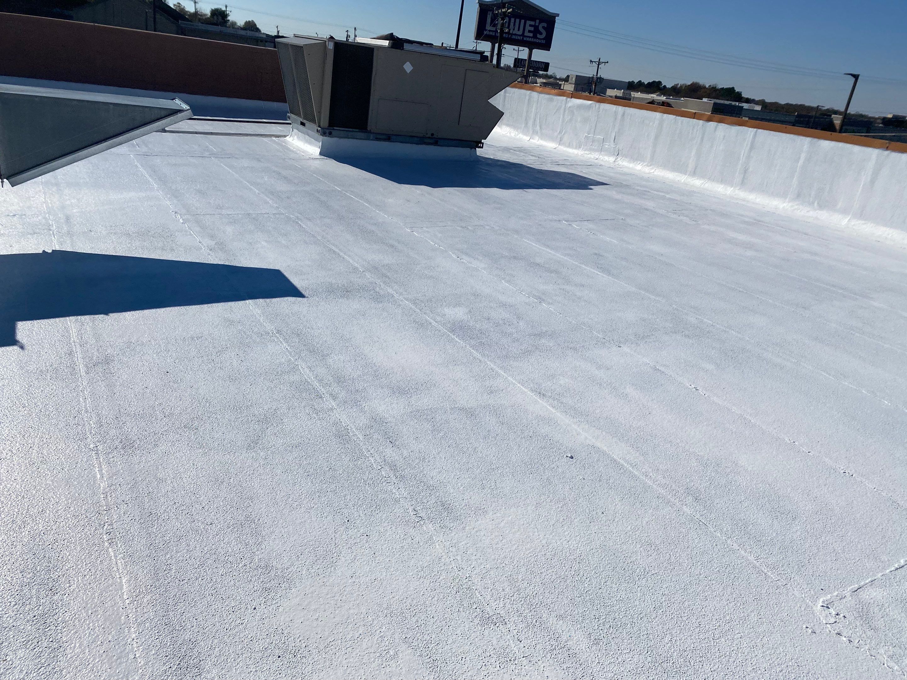 Commercial Coating using Poly Urerthane and Silicone Coating by Just In Time Roofing and Restoration