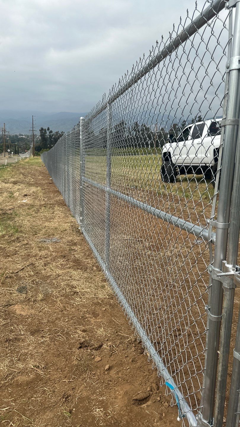 Fence installation using chain link wire by Fence Guys Inc. 