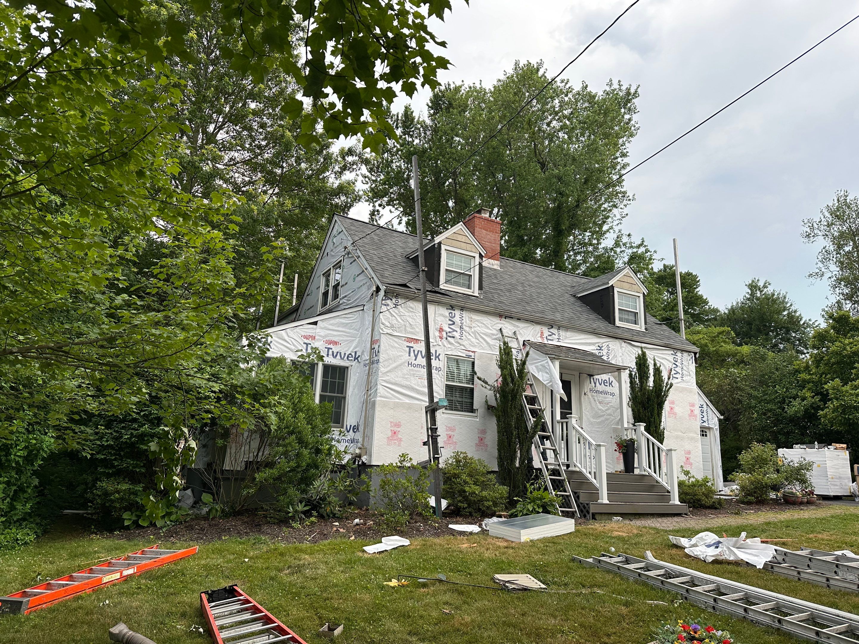 Complete Exterior Estate gray with Pacific Blue Siding by A Plus Exterior