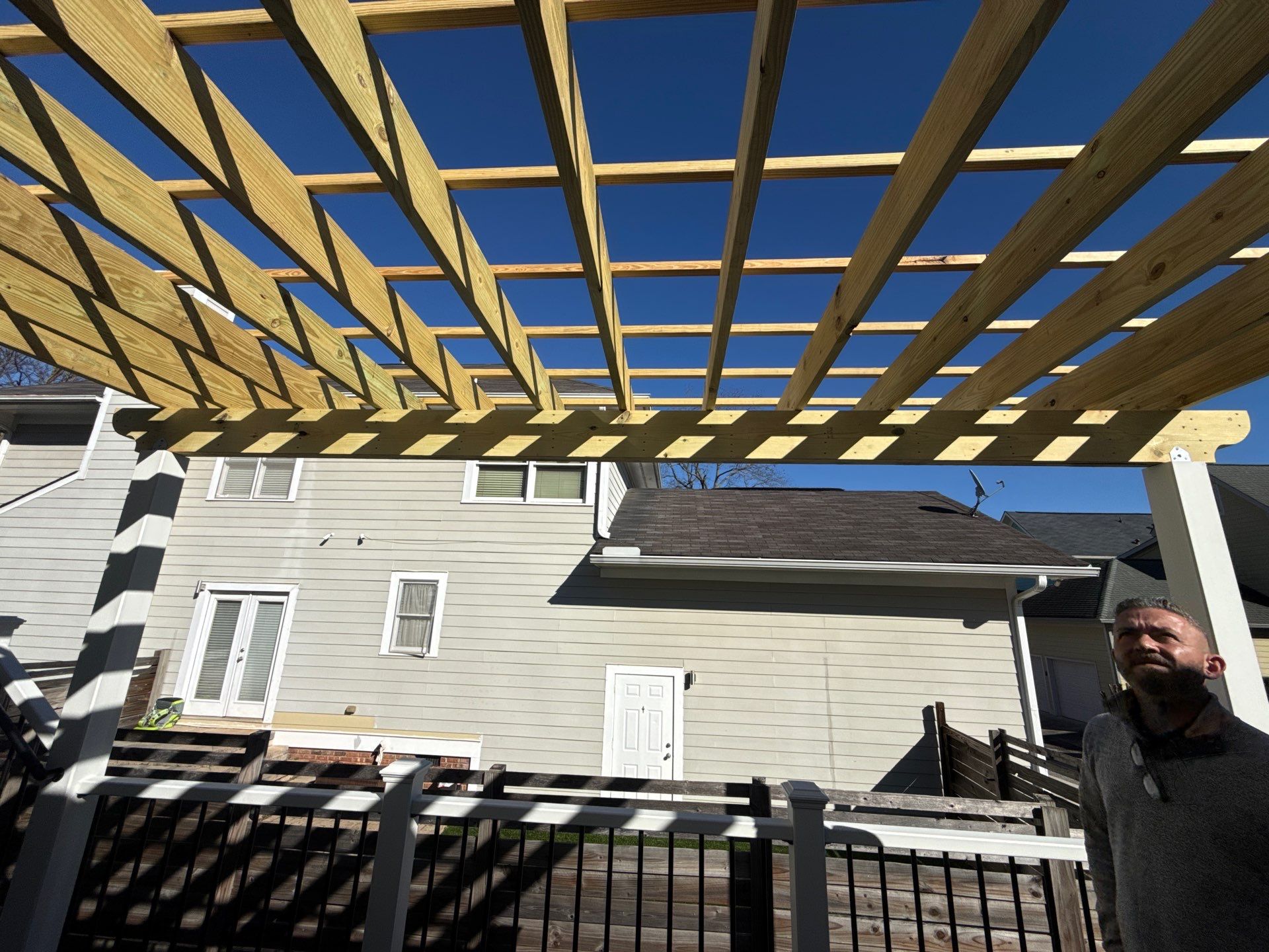 Atlanta, GA Deck Rebuild and Pergola Build using Deckorators Venture Series Decking, Trex Composite Railing, and Pressure Treated Pine by Nelson Exteriors 