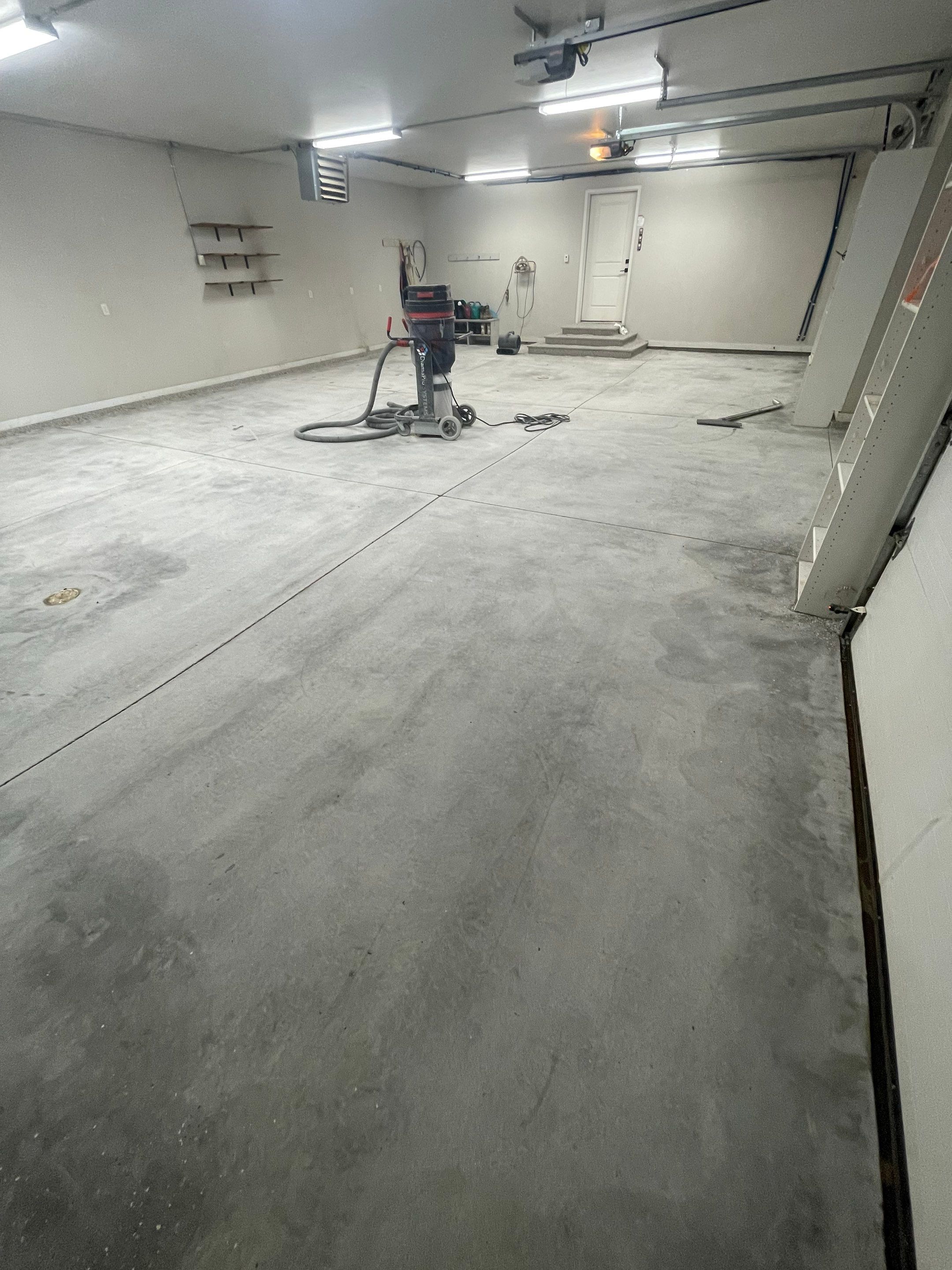 Grey Speckled Polyuera Garage Floor Coating for Hartford Three-Car Garage by Select Painting, Coatings & Garage Cabinets