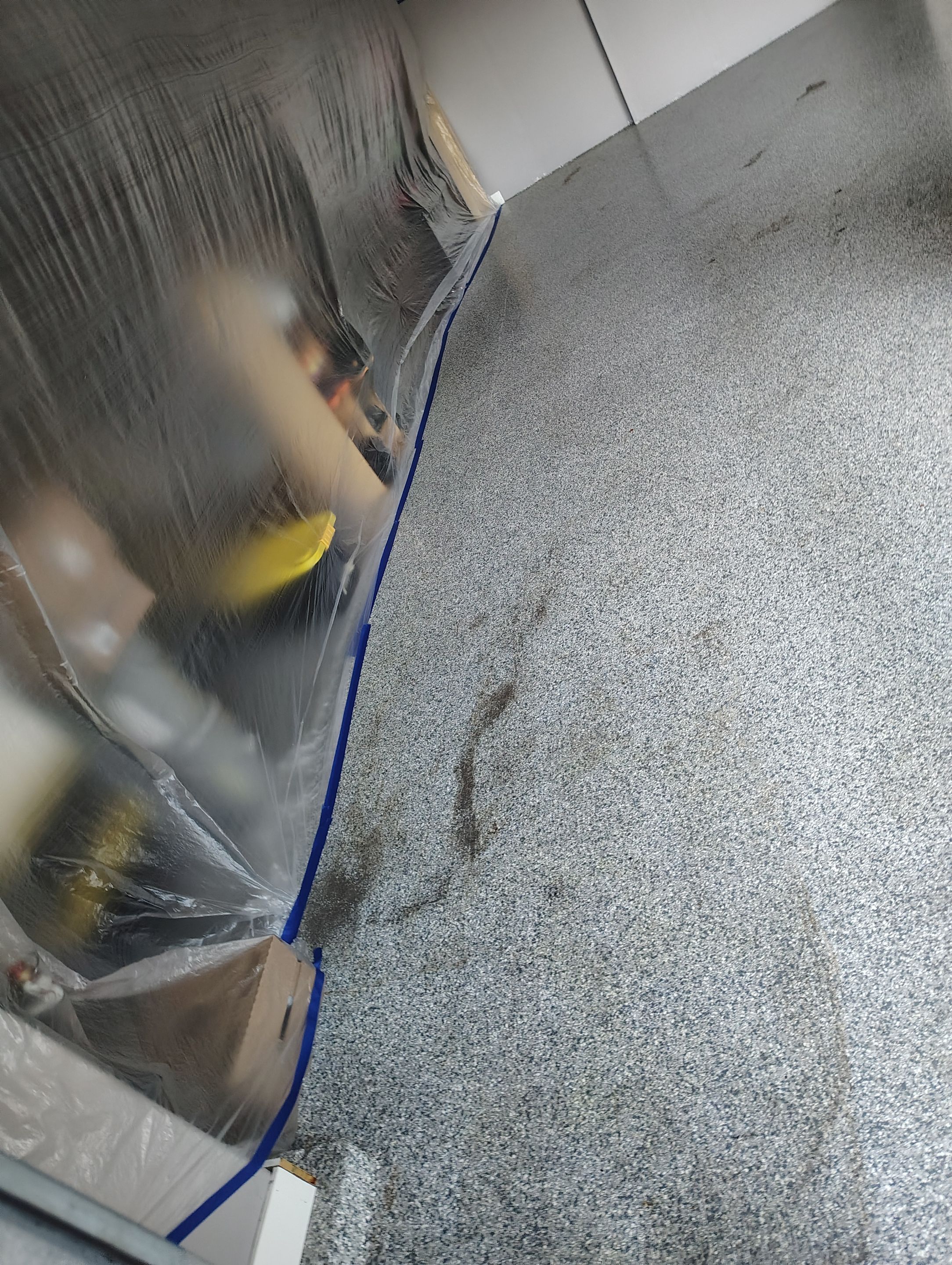 Grey Flecked Epoxy Garage Floor Installation in Sioux Falls by Select Painting, Coatings & Garage Cabinets