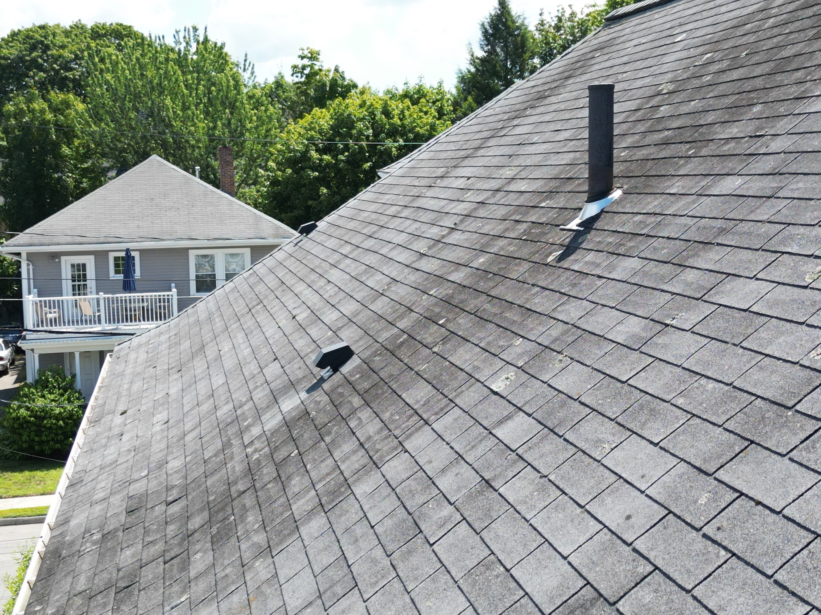 Roof Replacement with Skylight Flashing in Waltham, MA by Mighty Dog Roofing of Greater Middlesex County