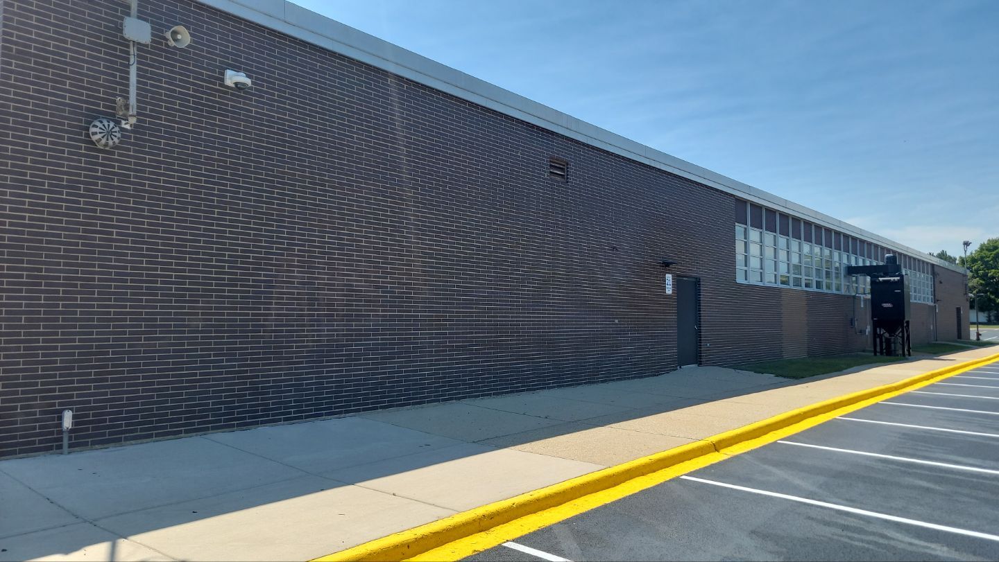 commercial pressure washing using Algaecide, soft wash soap by Northern Power Washing LLC.