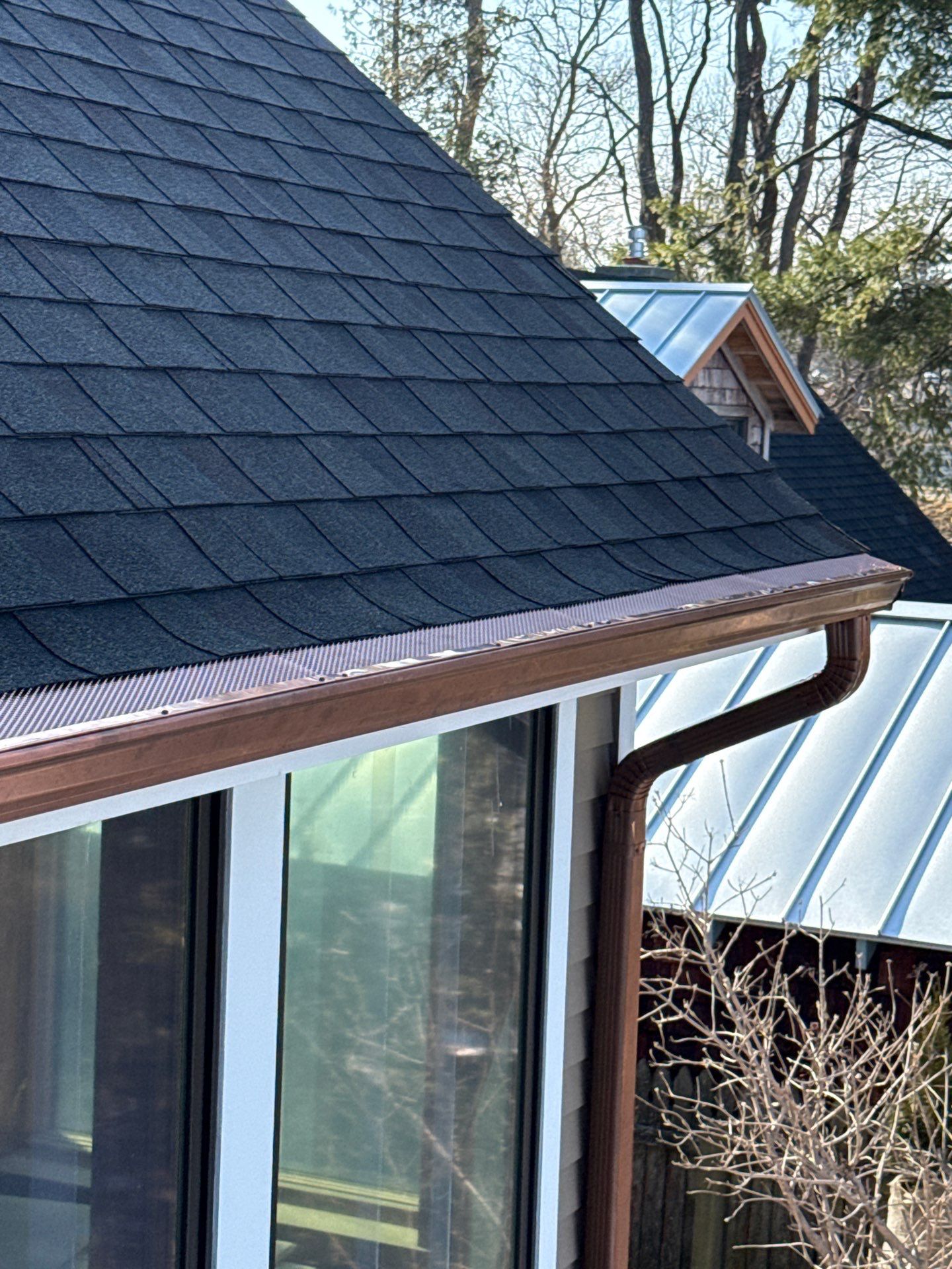 Copper Half Round Gutter Installation in Leland, MI by Rainbow Seamless Systems