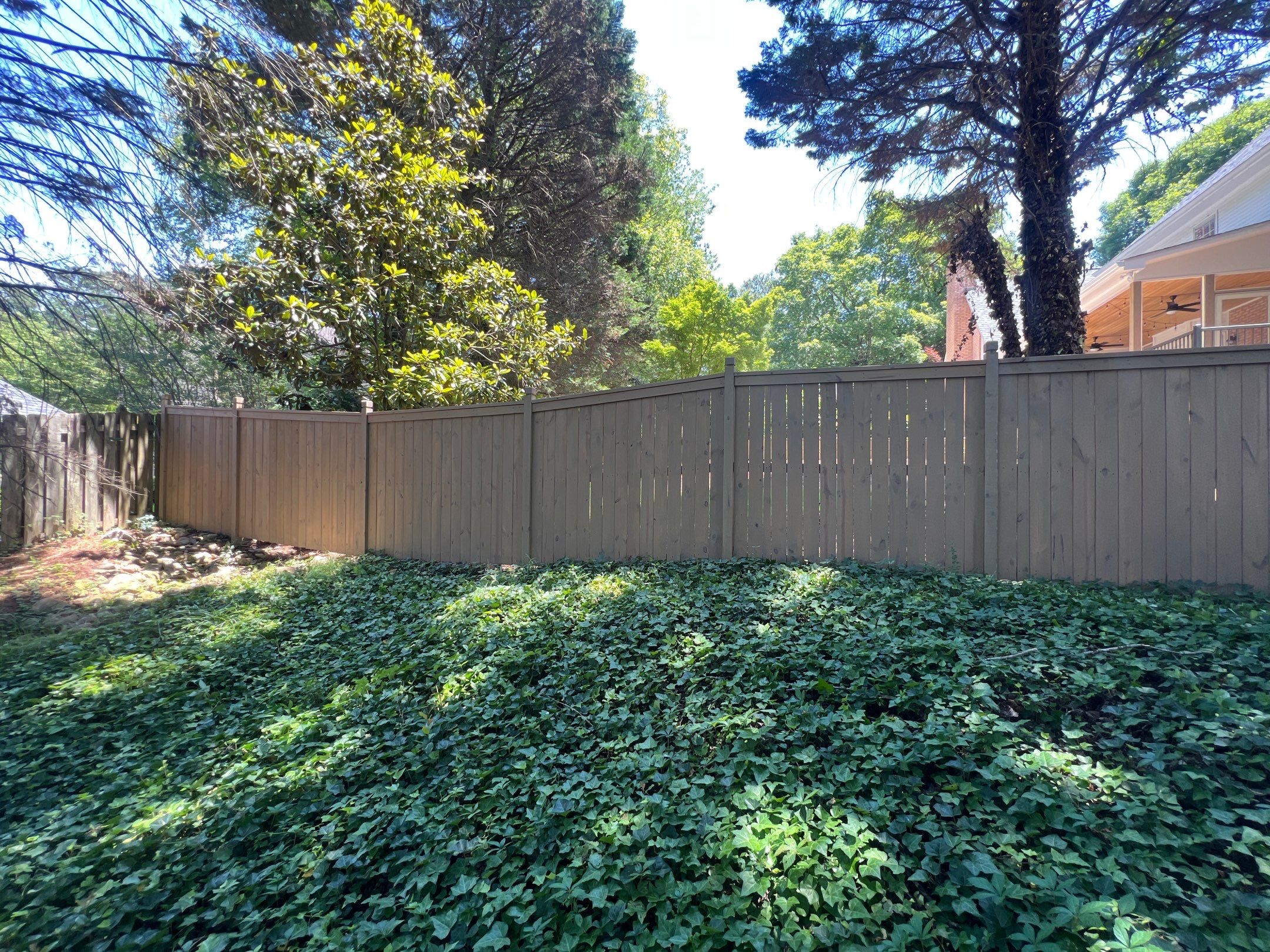 Pressure-Treated Wood Fence Installation and Deck Staining in Atlanta by Swift Home Renovations