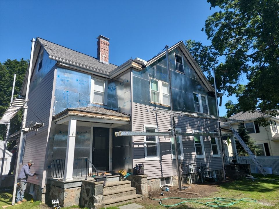 Vinyl siding layover project for 2 family in Wellesley, MA by UBrothers Construction