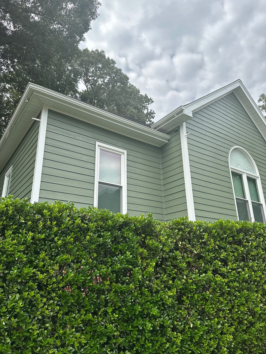 Raleigh Siding and Window Replacement with Custom Green Finish by The Remodeling Company