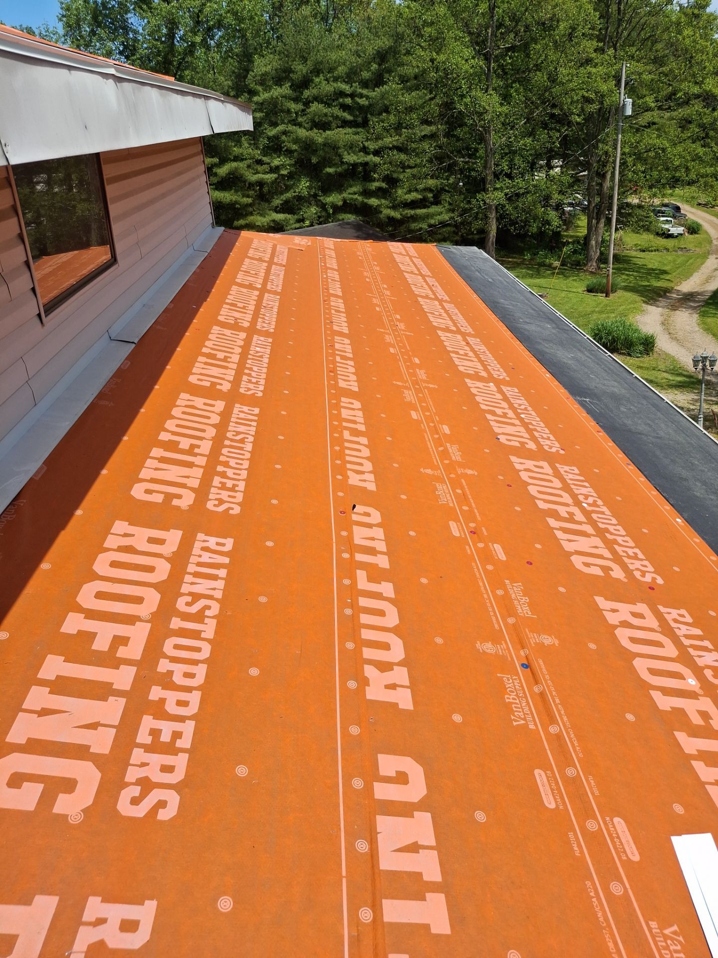 Residential Roofing Installation using GAF Timberline HDZ Charcoal by Rainstoppers Roofing