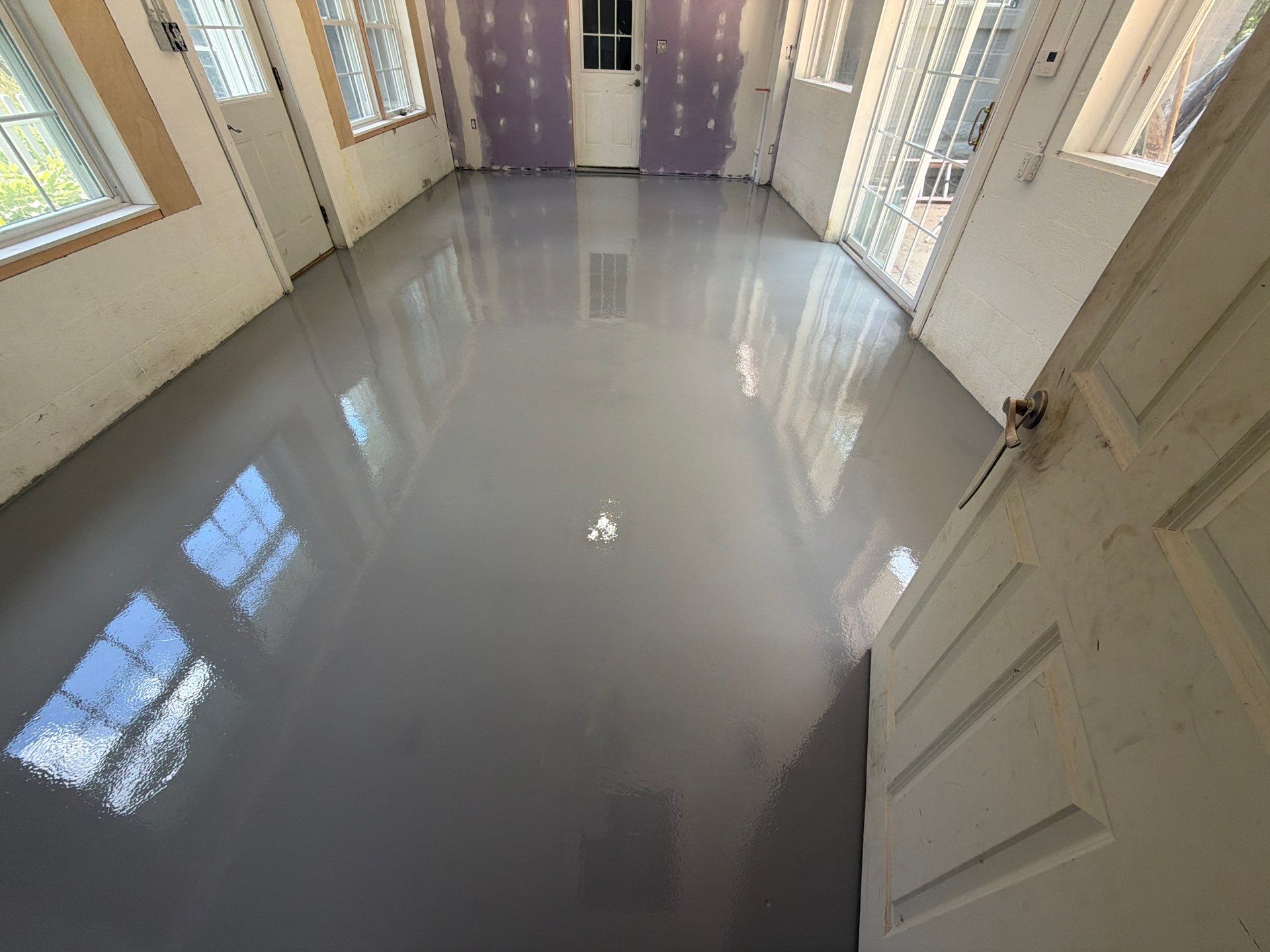 Grey Epoxy Flake Floor Installation for a Muskegon Sunroom by Gordon Painting