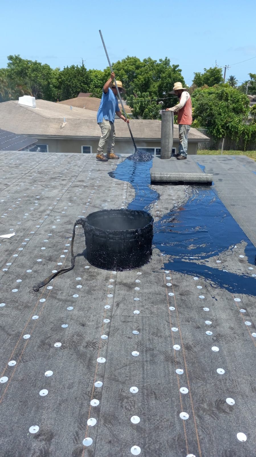 Standing Seam Metal & Flat Re-Roof using 1.5" Nail Strip 24ga Black Matte Kynar Coated Standing Seam Metal Panels by Morton Roofing, Inc.