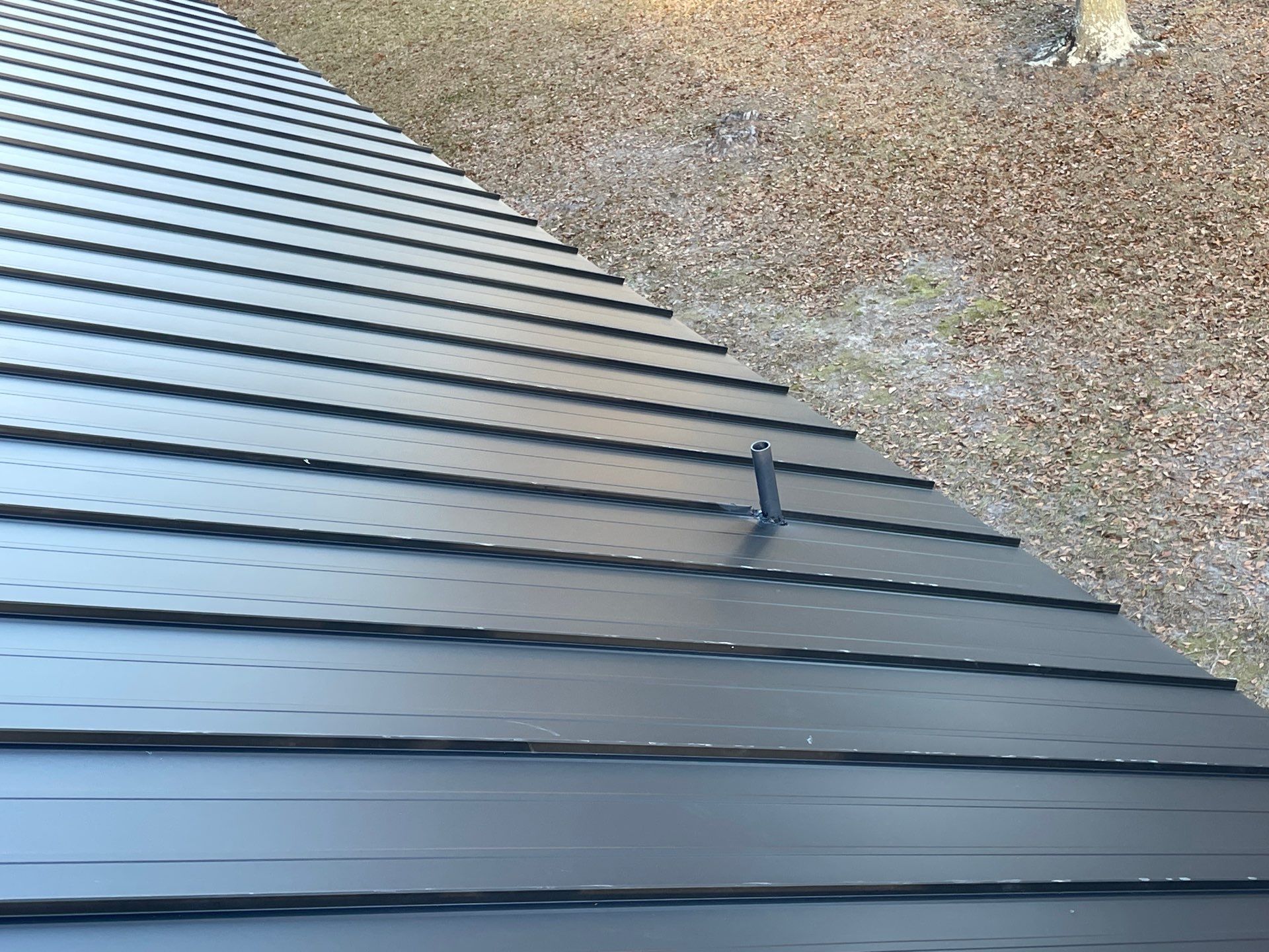 Residential Roofing Installation using Benton 26Ga 1inc Snapcock Metal Roof KYNAR Matte Black by Talya Roofing