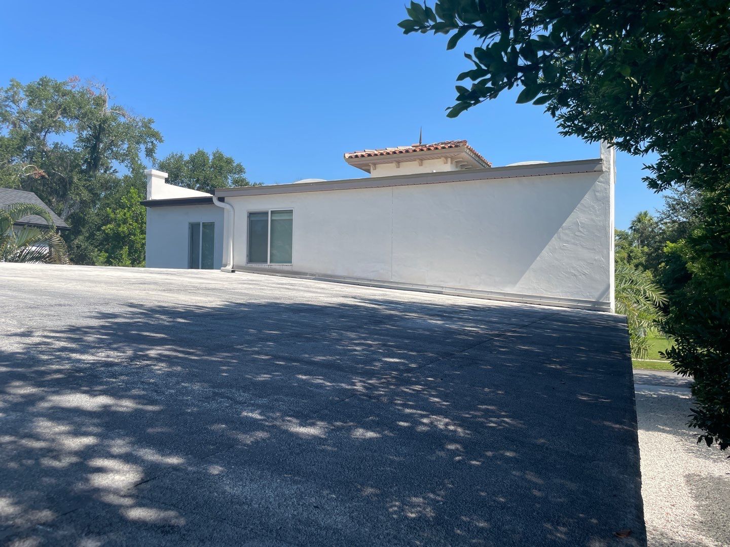 Residential Flat Roof Membrane and Tile Accents in Winter Park by Tip Top Roofing Co., Inc.