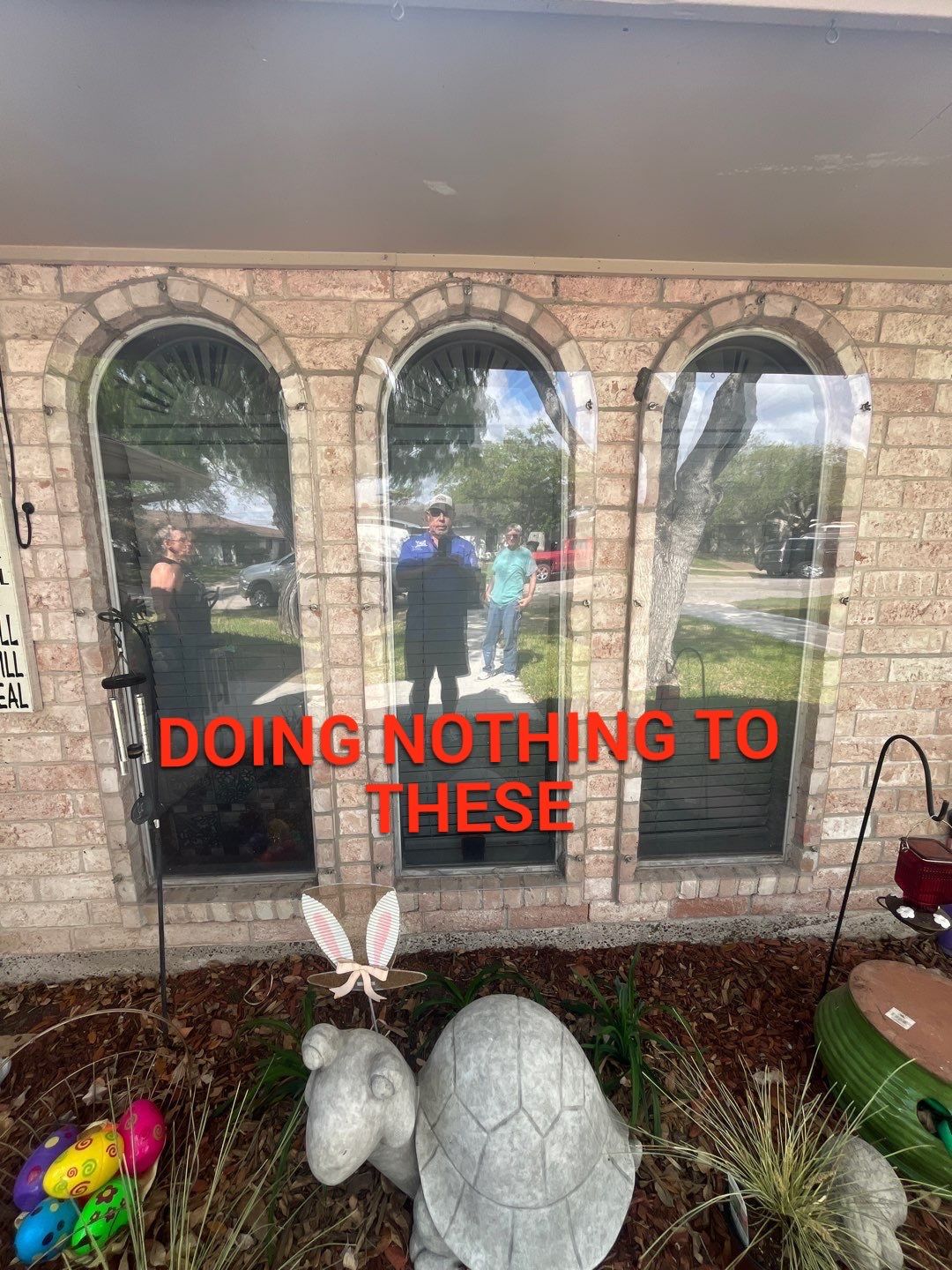 Colored Vinyl Windows to blend into brick by Bayfront Roofing and Construction