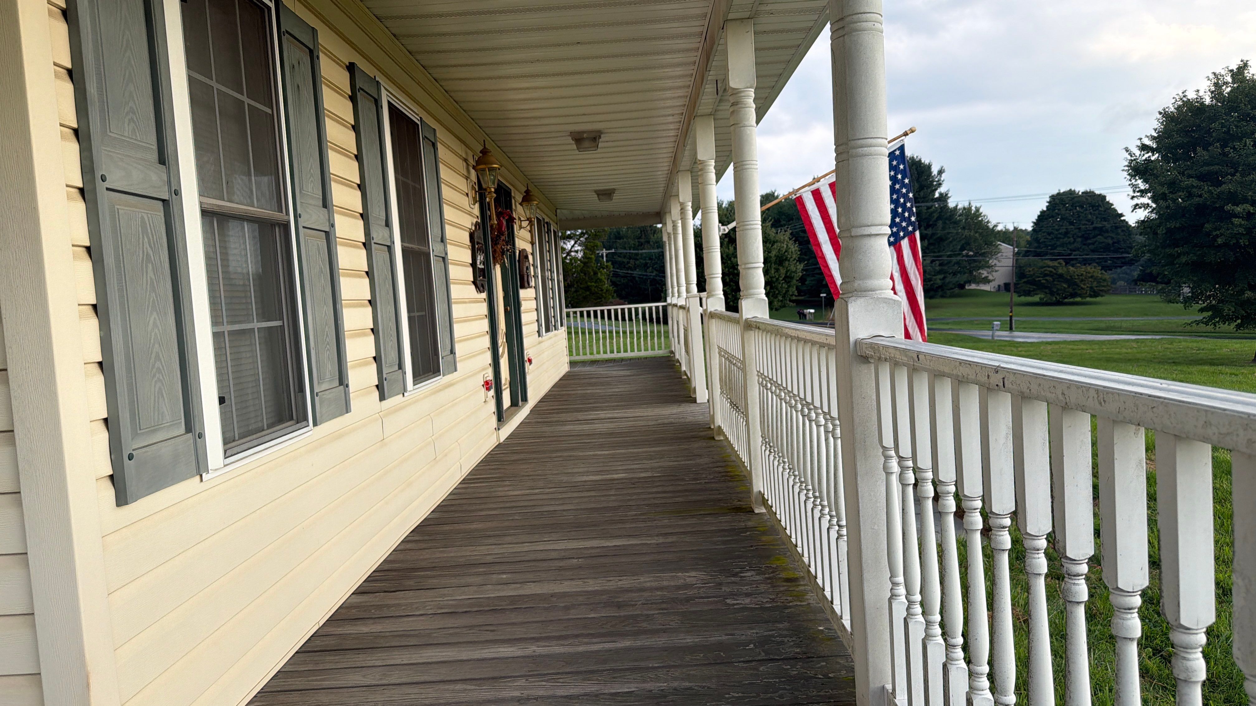 Vinyl Siding House Washing and Wood Deck Restoration in Carroll County by Baltimore Pressure Washers Inc.