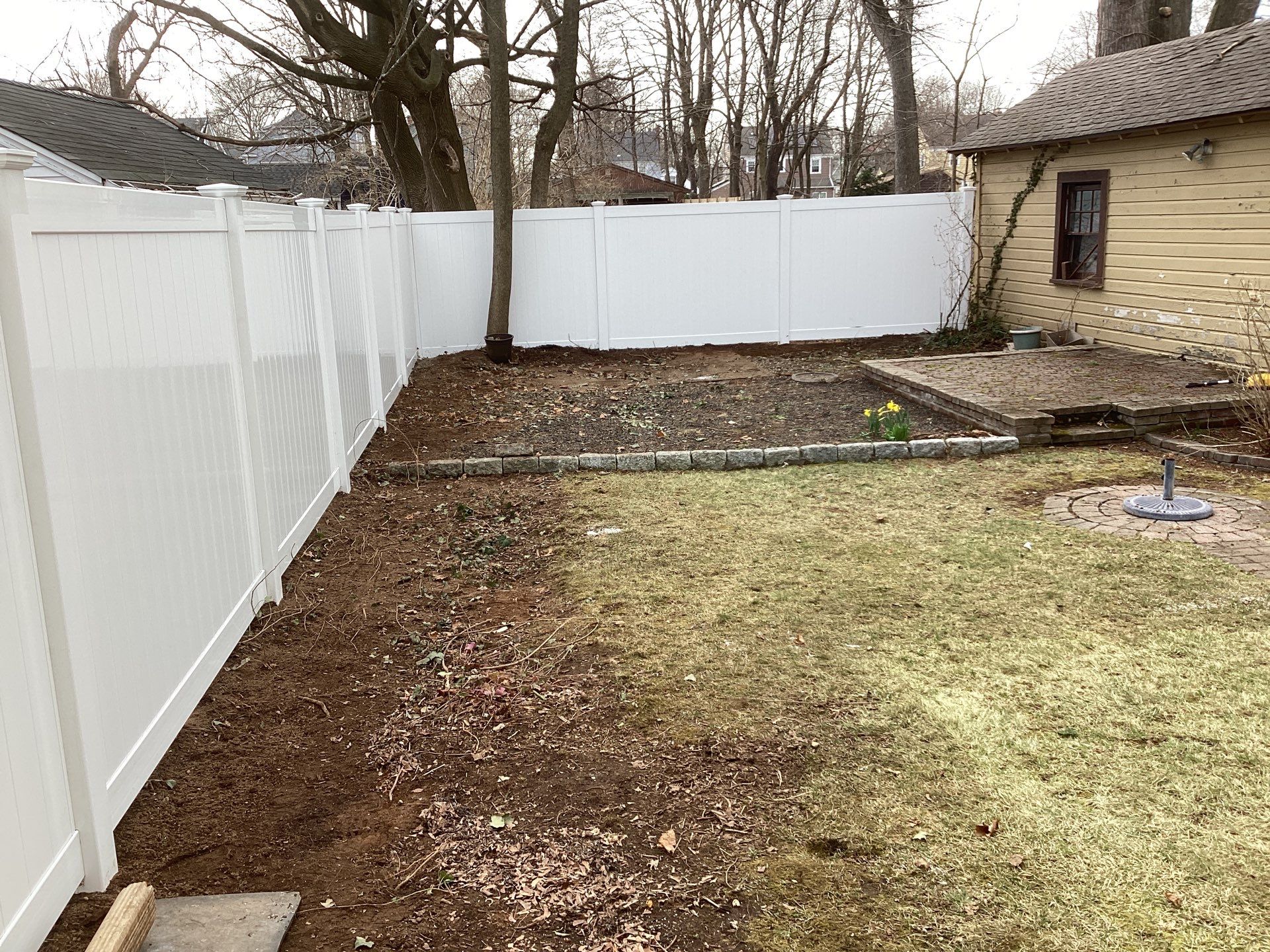 Fence replacement with White Vinyl privacy fence by DiGiorgi Roofing and Siding Inc