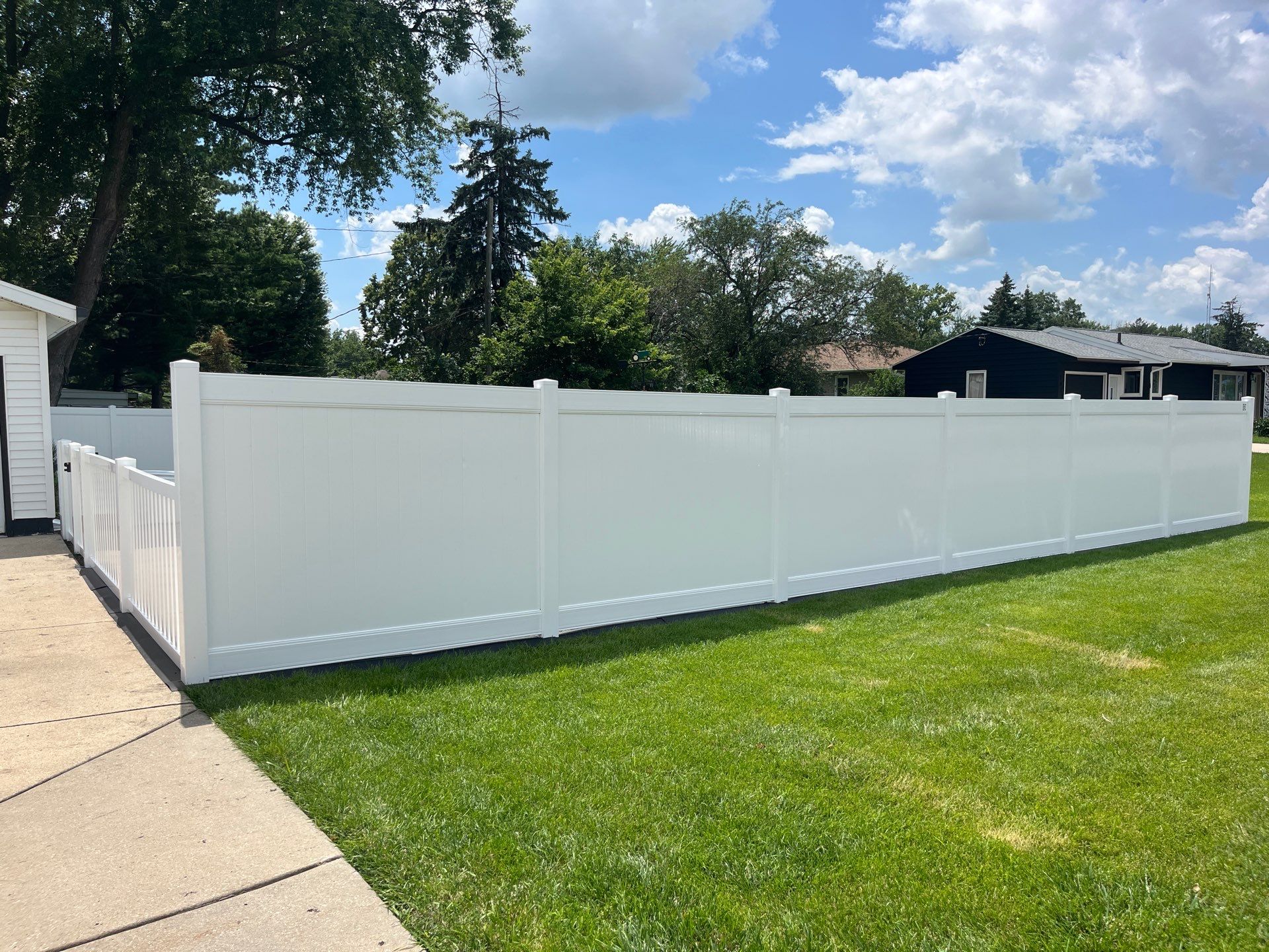 White Vinyl Privacy and Picket Fence Installation in Waterloo by Perfect Picket Fence and Stain