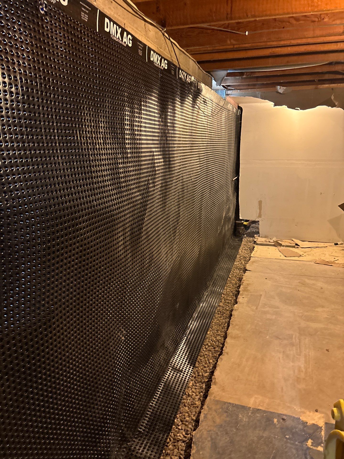 Interior Drain Tile & Buried Discharge in South Minneapolis by Waterproofing Northeast