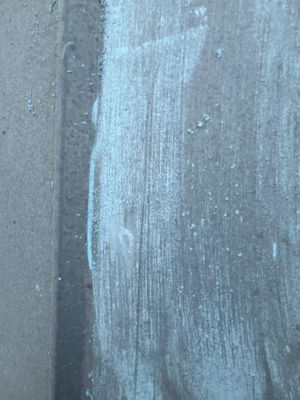Close up of metal roof panel with chalk markings
