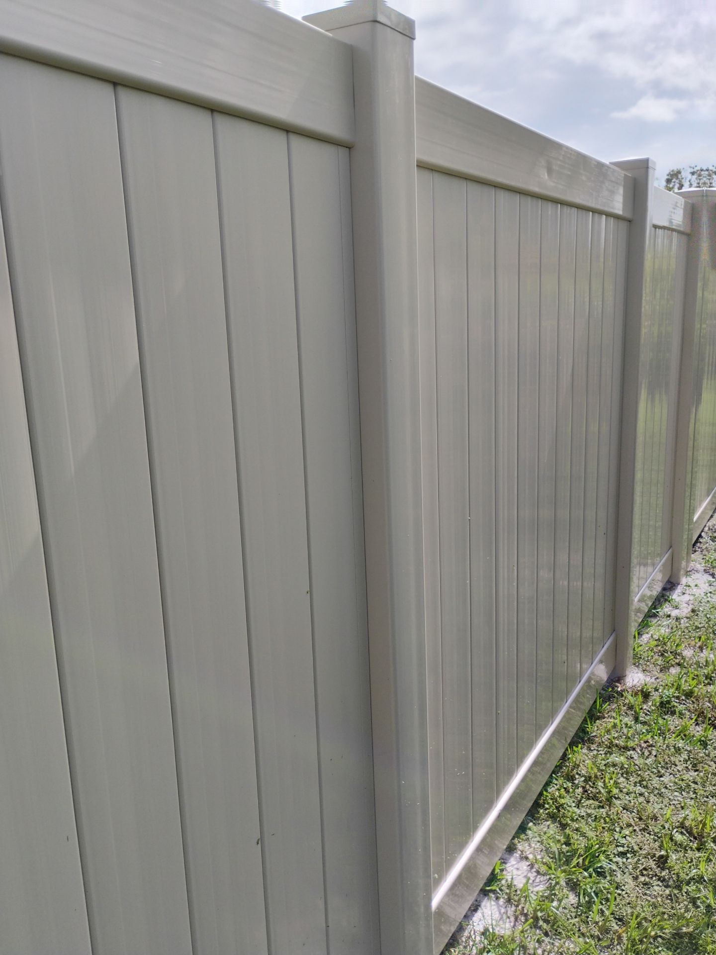 Residential Tan Vinyl Privacy Fence Installation in Nokomis by True Fence LLC