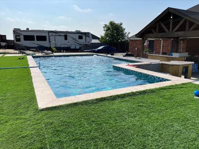 Modern Geometric Pool with Sunken Lounge and Turf Surround