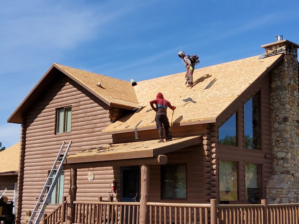 Hill Country Guest Ranch using Steel Roofing, Gutters, Log Cabin Staining by Lightning Exteriors